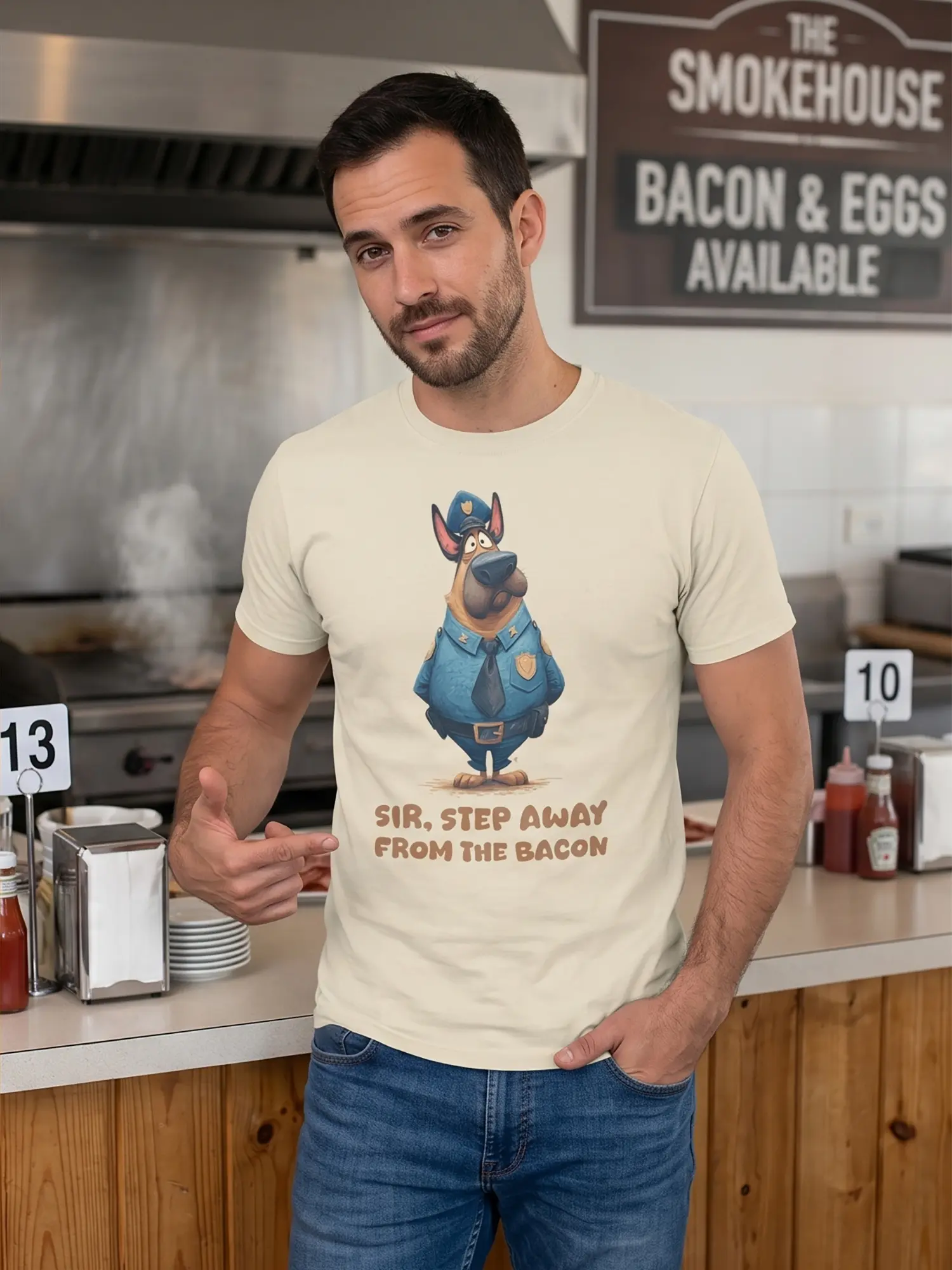 Man wearing the Bacon Patrol Dog T-Shirt pointing at the design