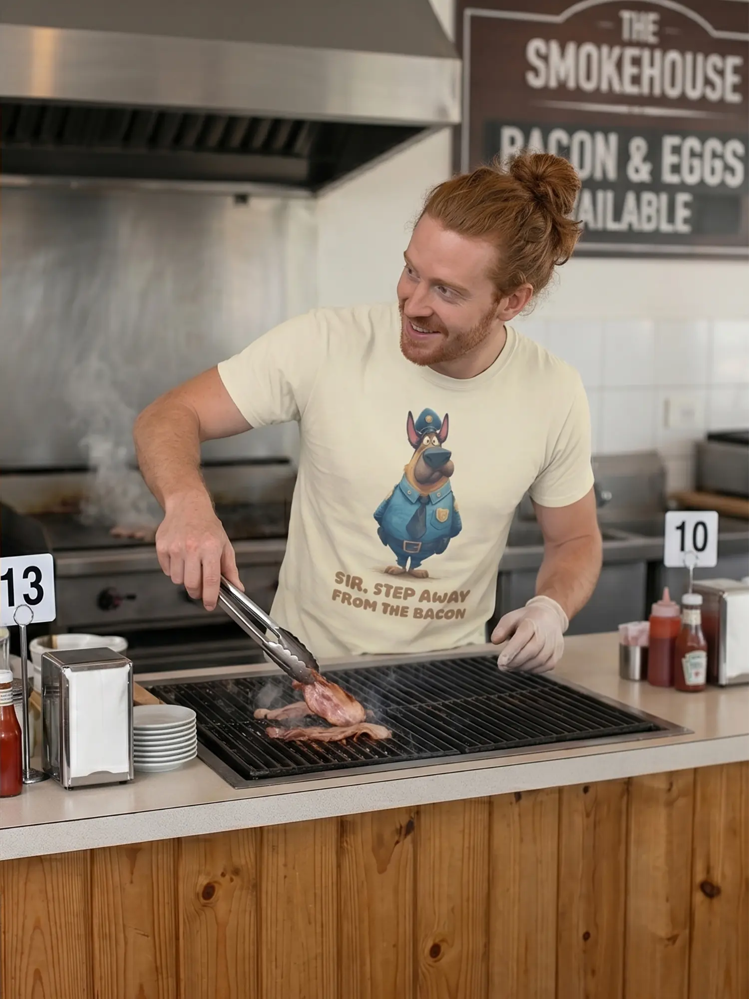 Man wearing the Bacon Patrol Dog T-Shirt actively grilling bacon