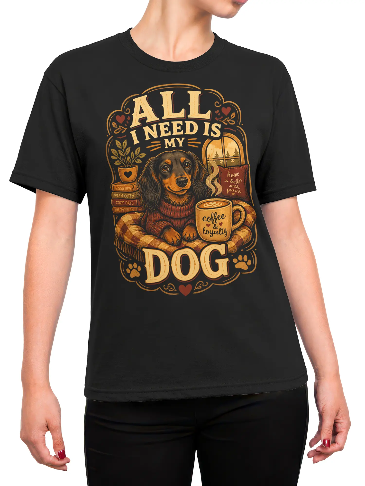 Woman wearing black tee with cozy dog, coffee mug, and “All I Need Is My Dog” vintage design