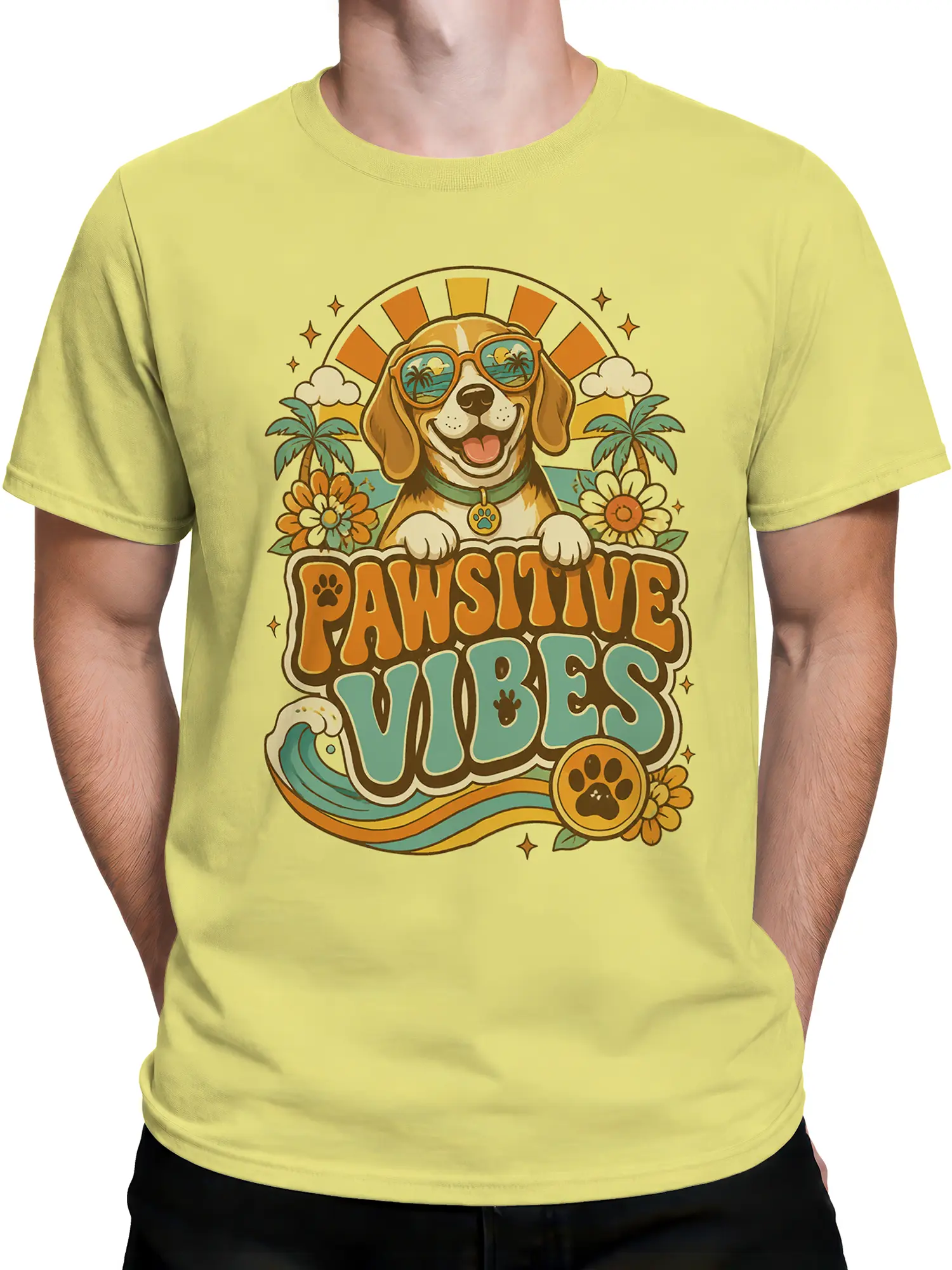 Man wearing yellow Pawsitive Vibes dog graphic shirt with retro beach art