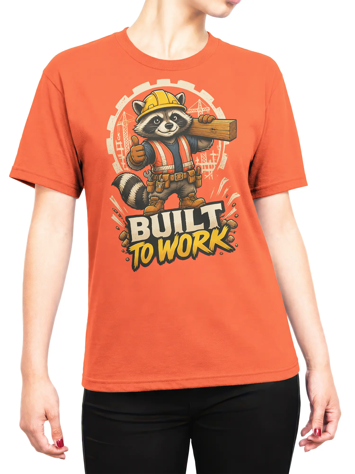 Woman wearing the orange Built To Work raccoon construction shirt, showing fit and bold worksite graphic on the front.