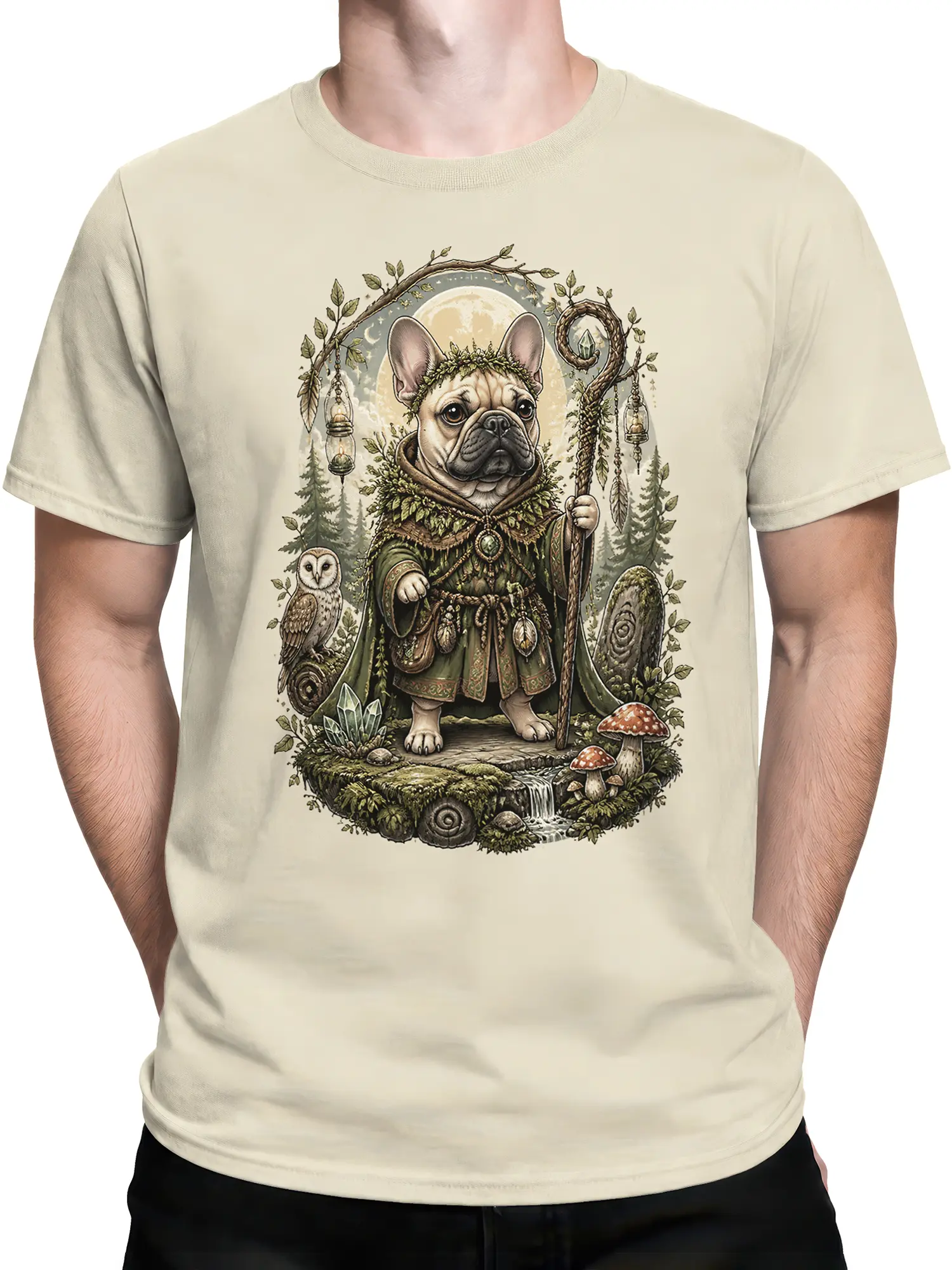 Man wearing beige T-shirt featuring French Bulldog druid with staff, owl and moonlit forest artwork