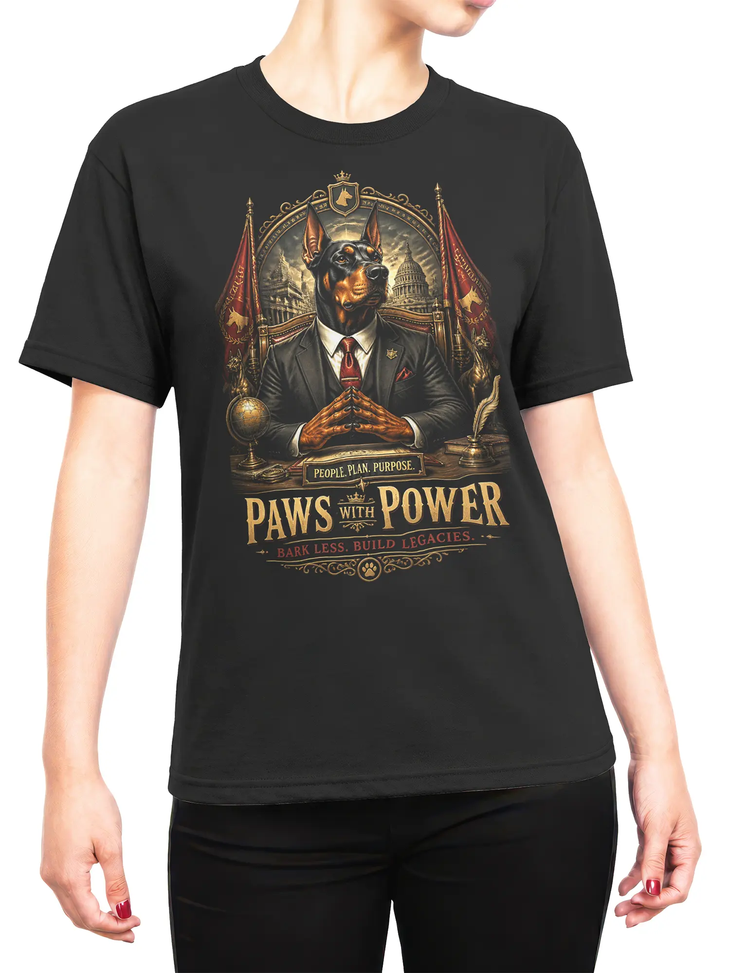 Woman wearing black Paws With Power Doberman T-Shirt showing the full regal dog leader design across the chest