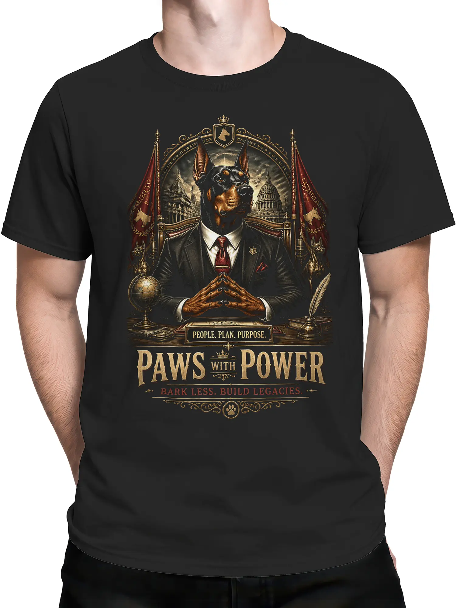 Man wearing black Doberman Paws With Power shirt with the ornate political-style leader design centered on the chest