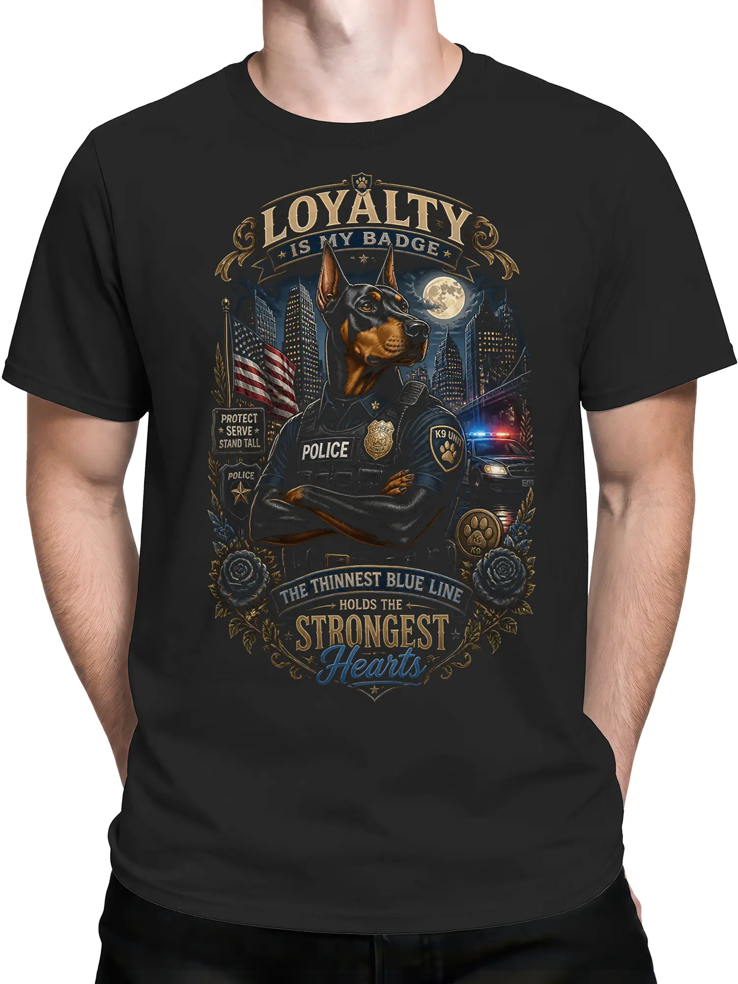 Man wearing black Doberman K9 police officer T-shirt with thin blue line loyalty artwork and city skyline graphic.
