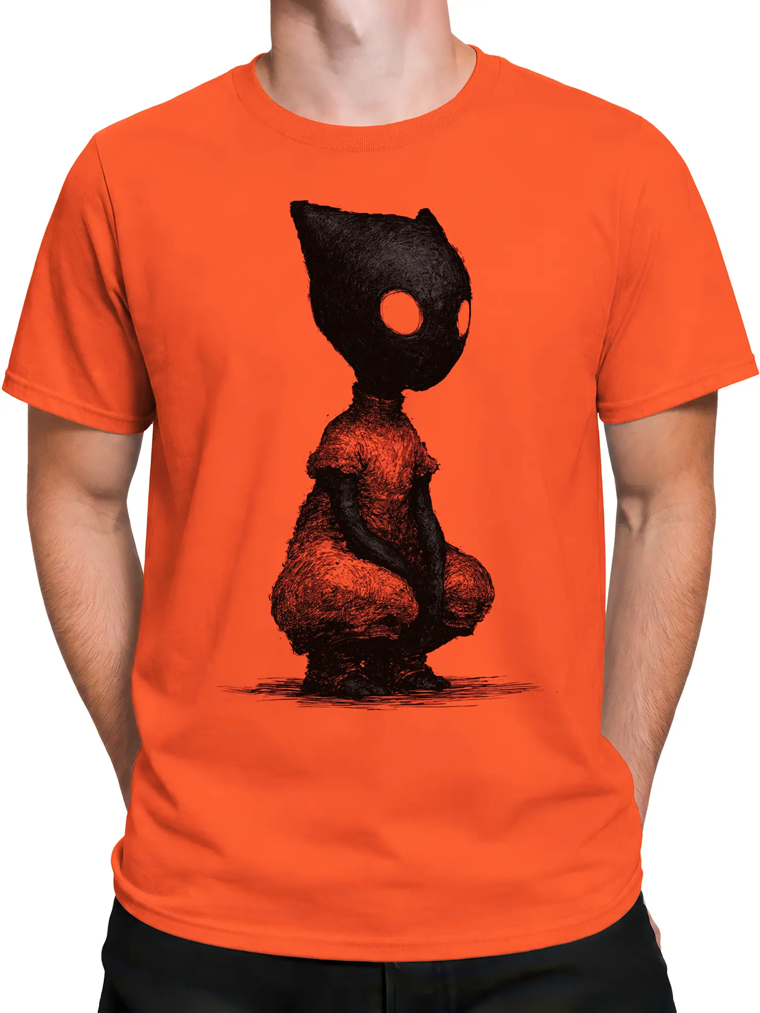 Man wearing orange shirt with black hollow-eyed crouching cat creature graphic on chest