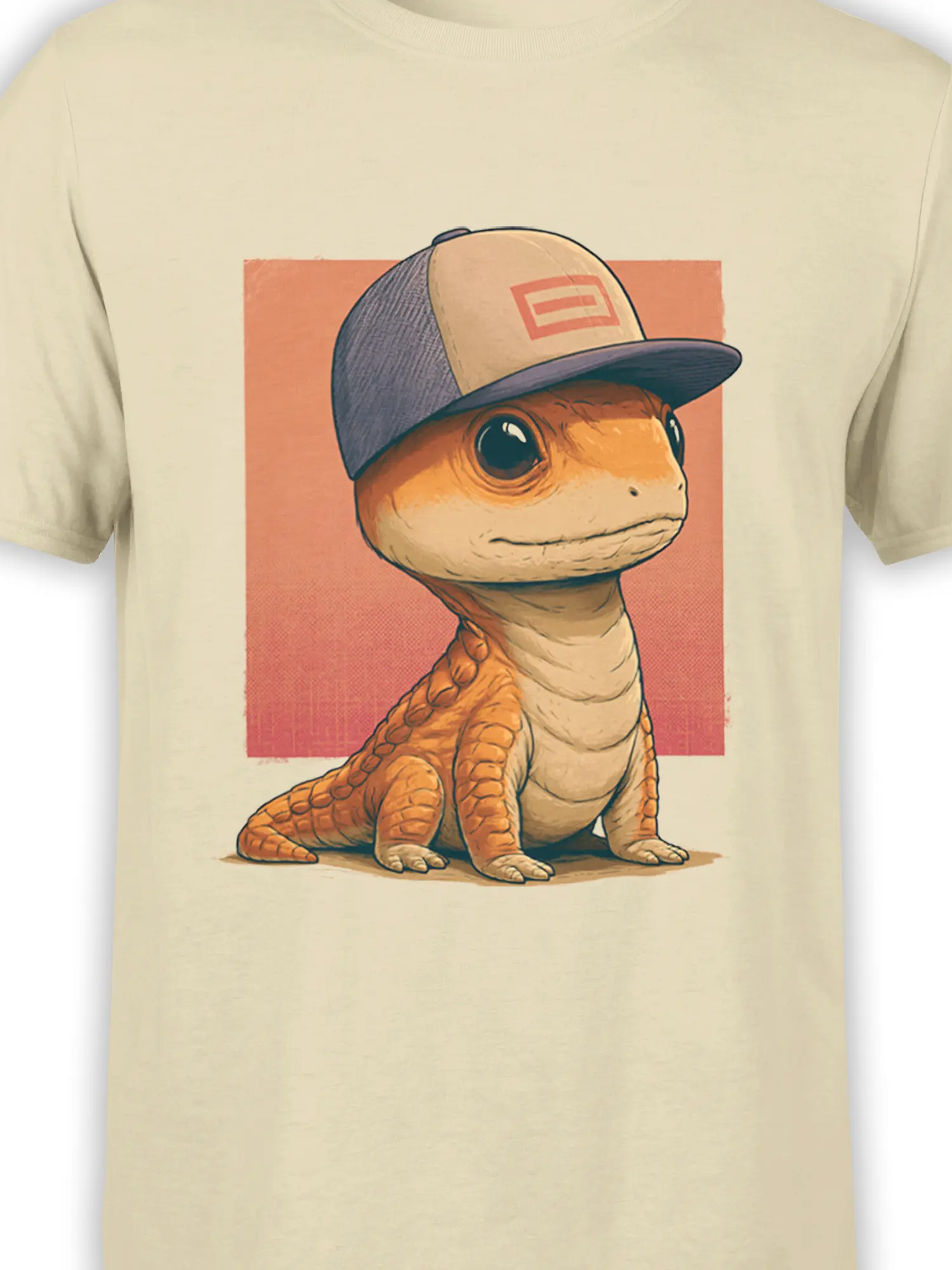 Close-up of cute orange lizard in a cap graphic on beige shirt with peach square background