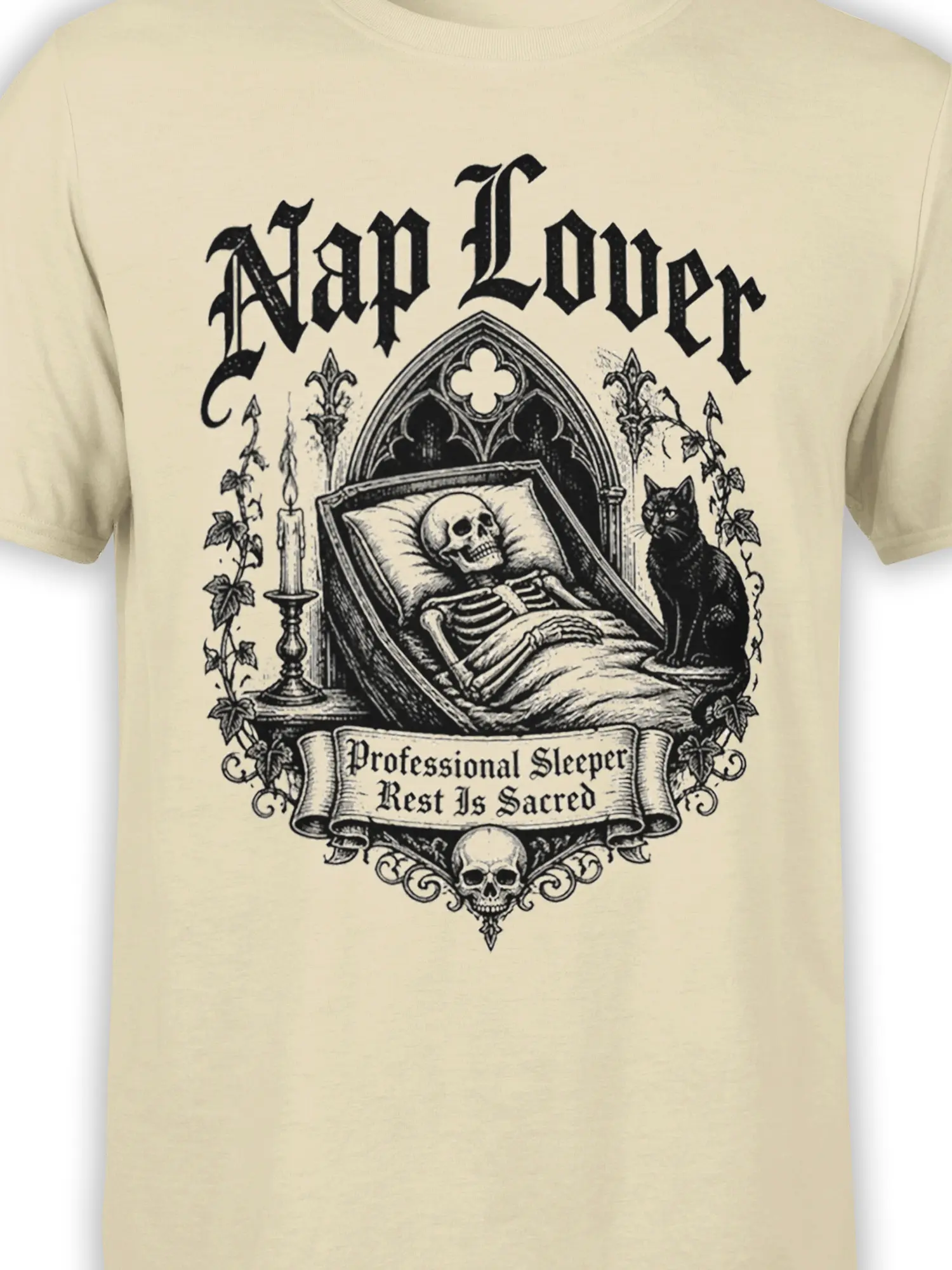 close-up of gothic skeleton in bed with black cat and nap lover banner printed on beige fabric