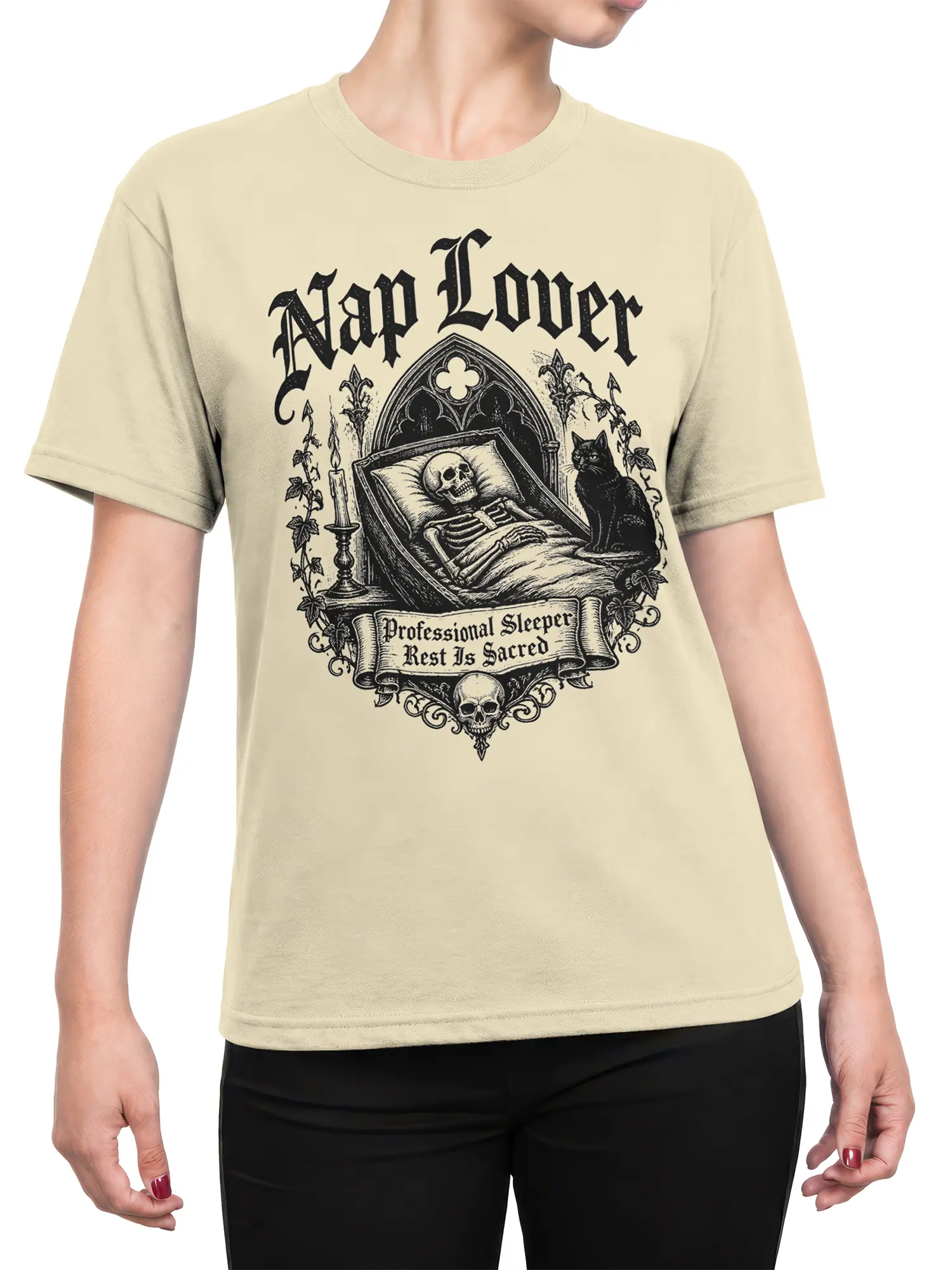 female model wearing beige nap lover skeleton shirt with gothic cat and candle artwork