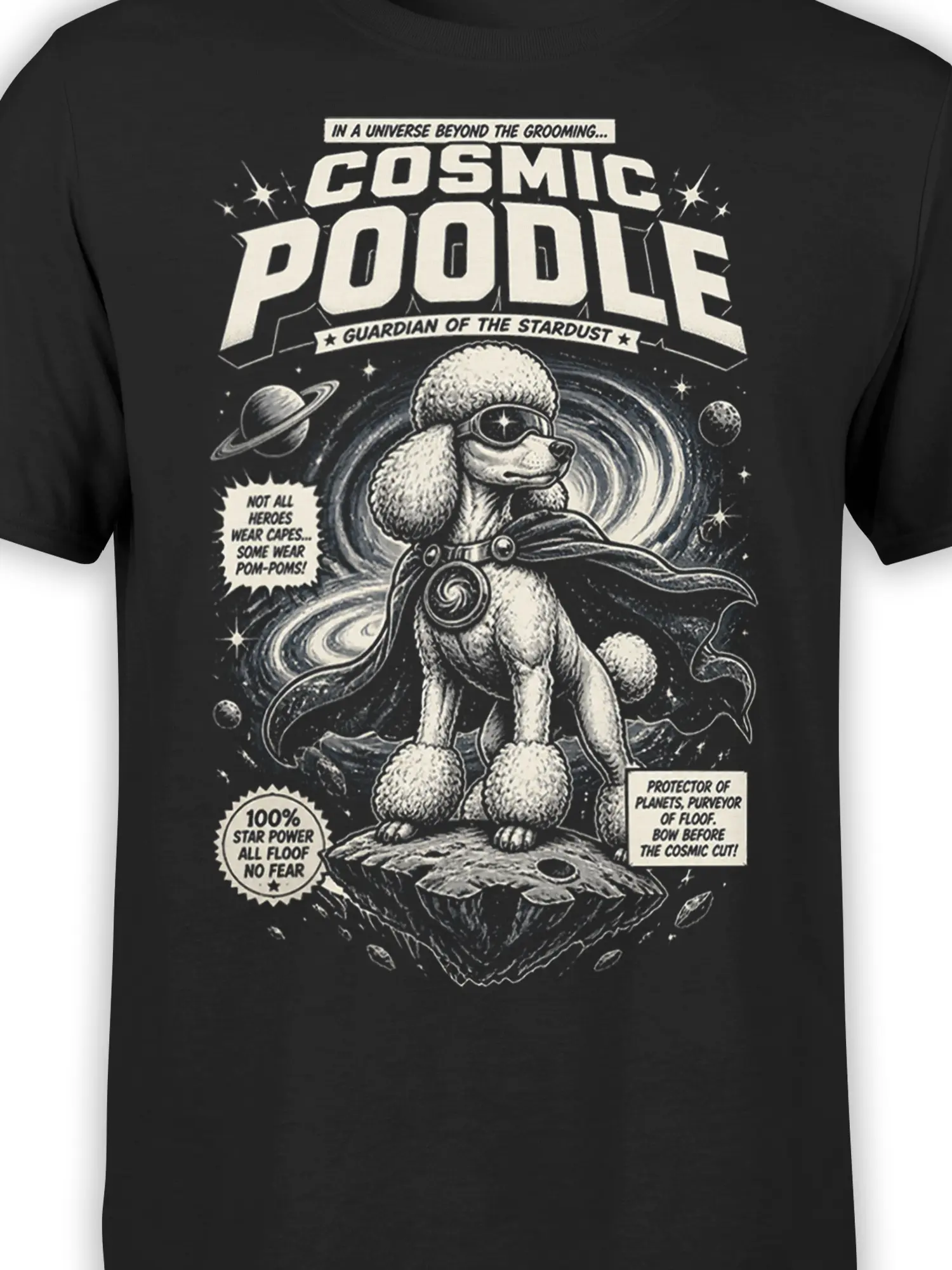 close-up of cosmic poodle superhero artwork with cape, pom-poms, and retro comic text on black fabric