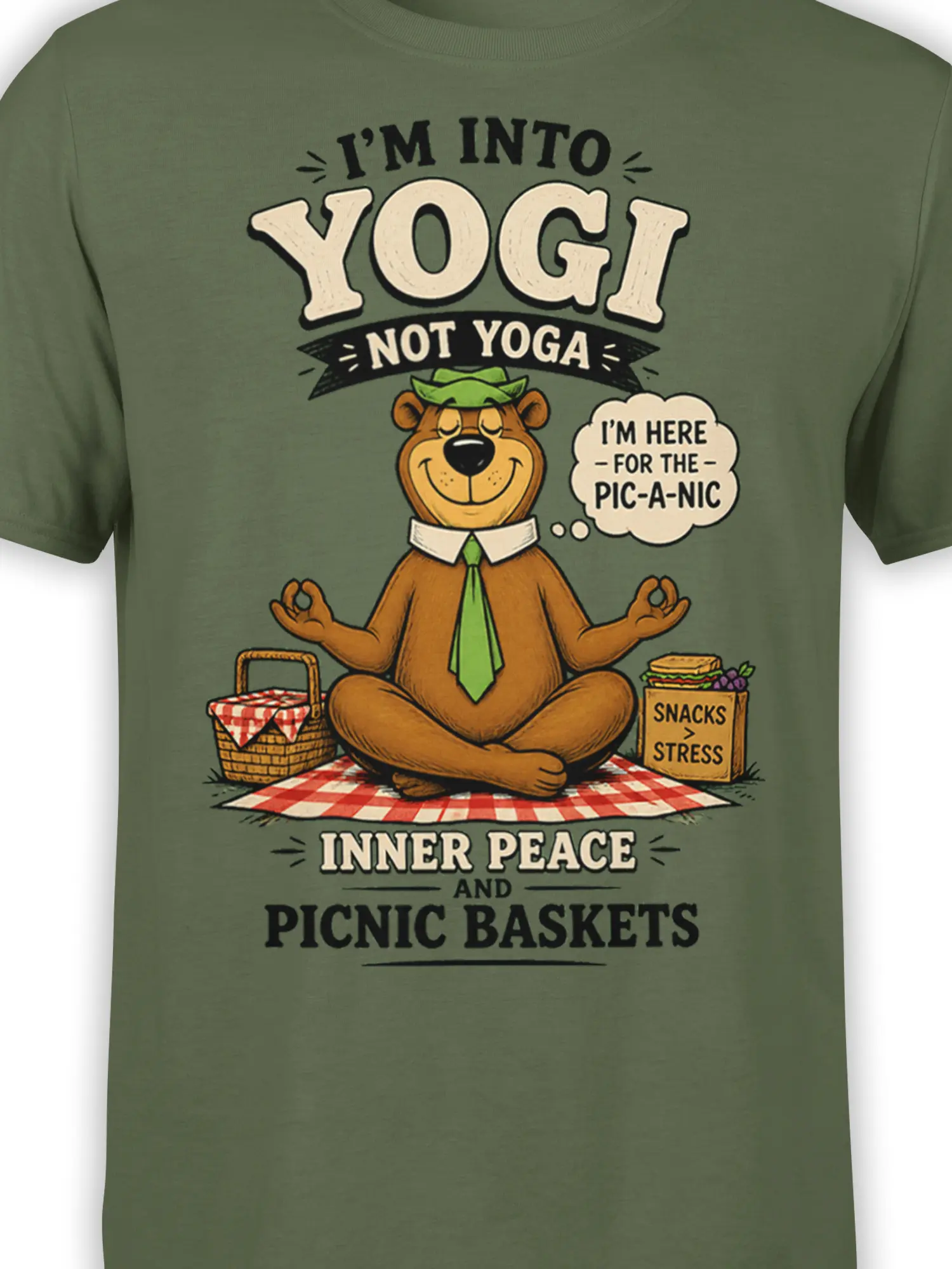 close-up of meditating picnic bear graphic and funny snack quote on olive green cotton shirt