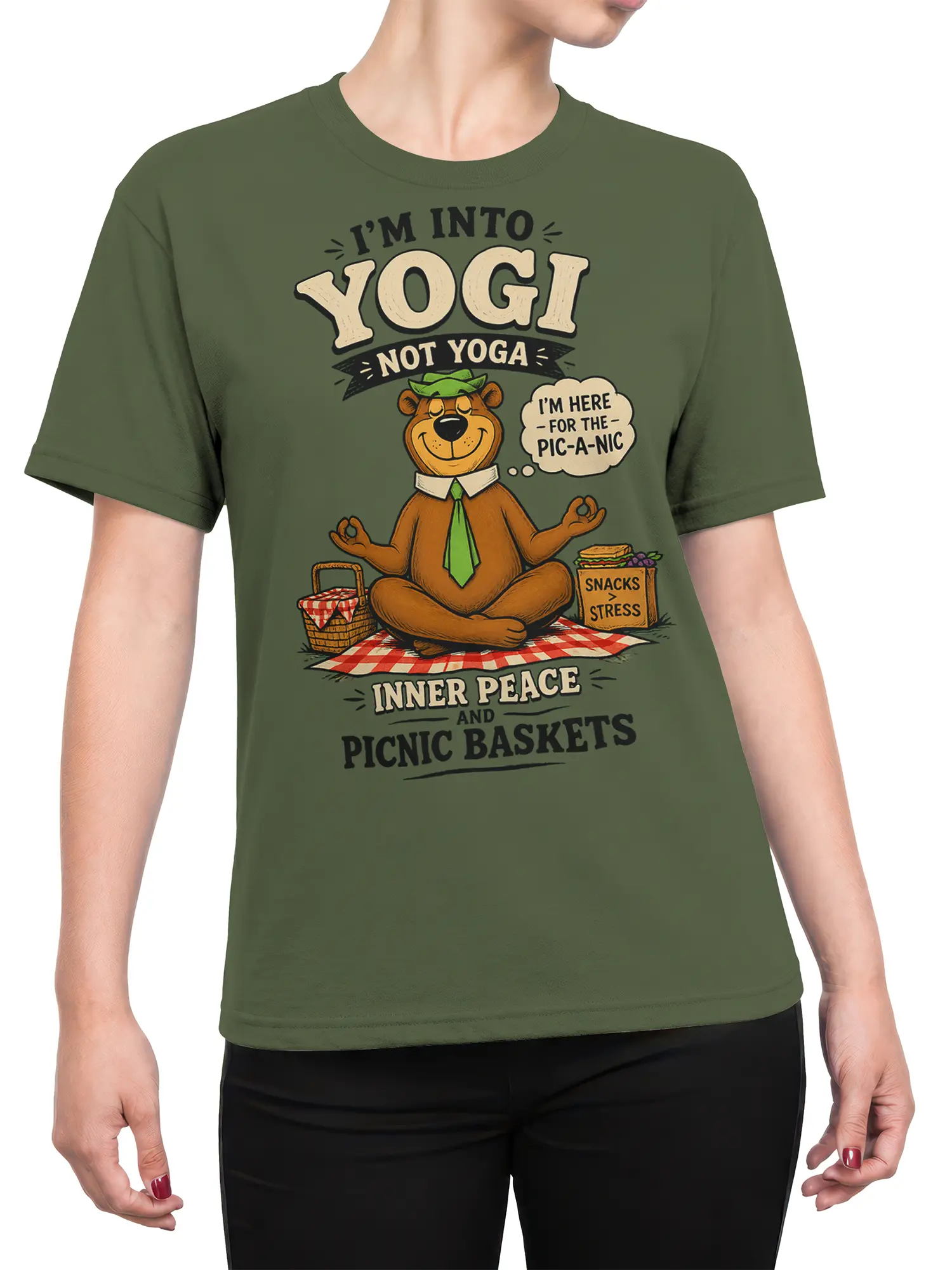 female model wearing olive green picnic bear yoga parody shirt with meditating bear design