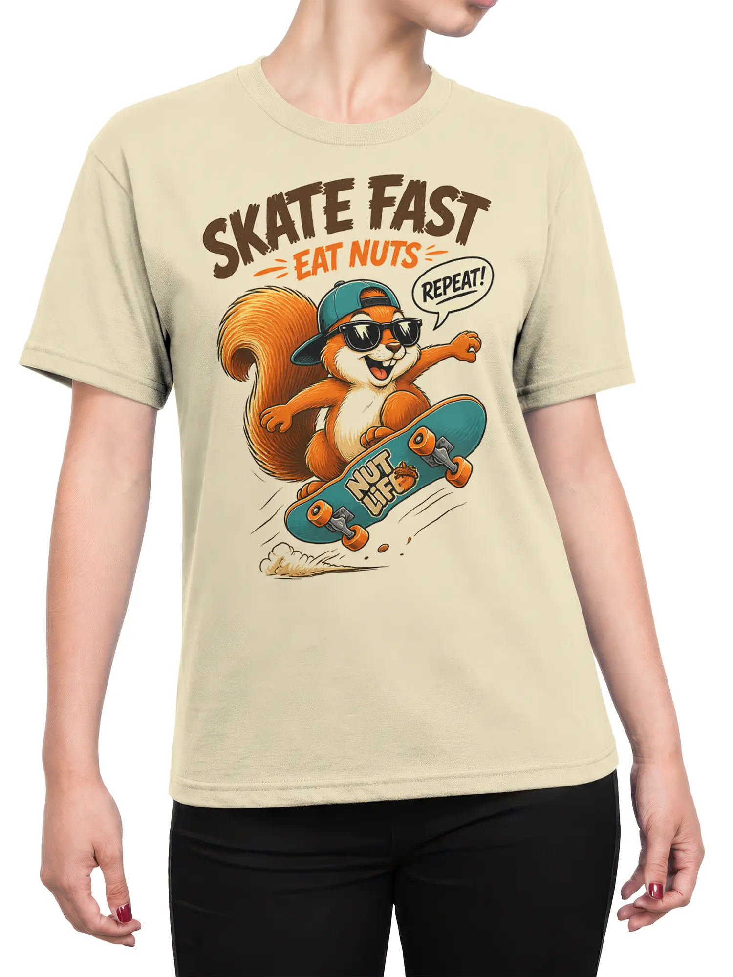 Woman wearing beige skater squirrel t-shirt with cartoon squirrel on teal skateboard and Skate Fast Eat Nuts Repeat slogan