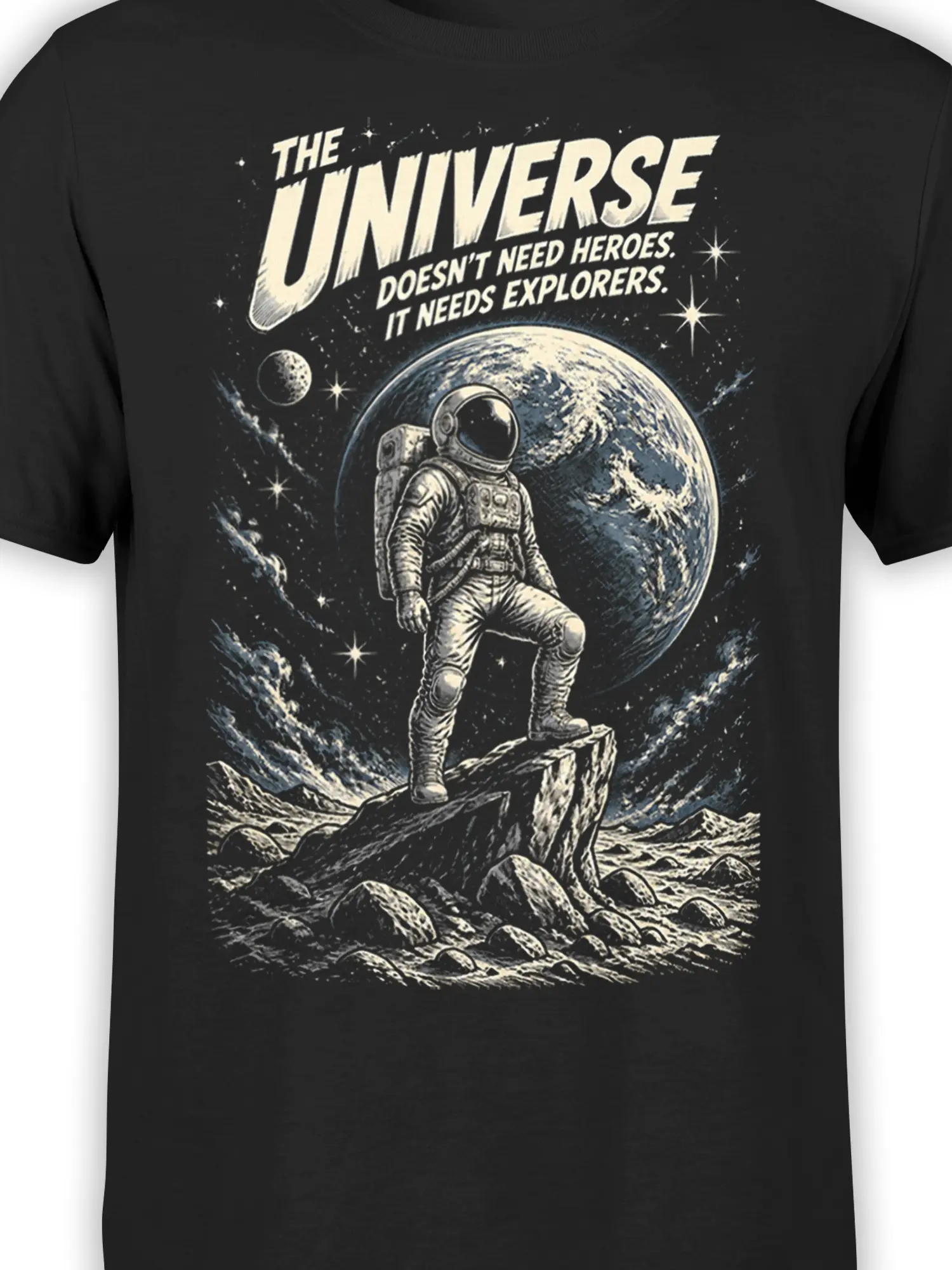 Close-up of black astronaut shirt graphic showing a giant planet, stars, rocky landscape, and bold explorer lettering