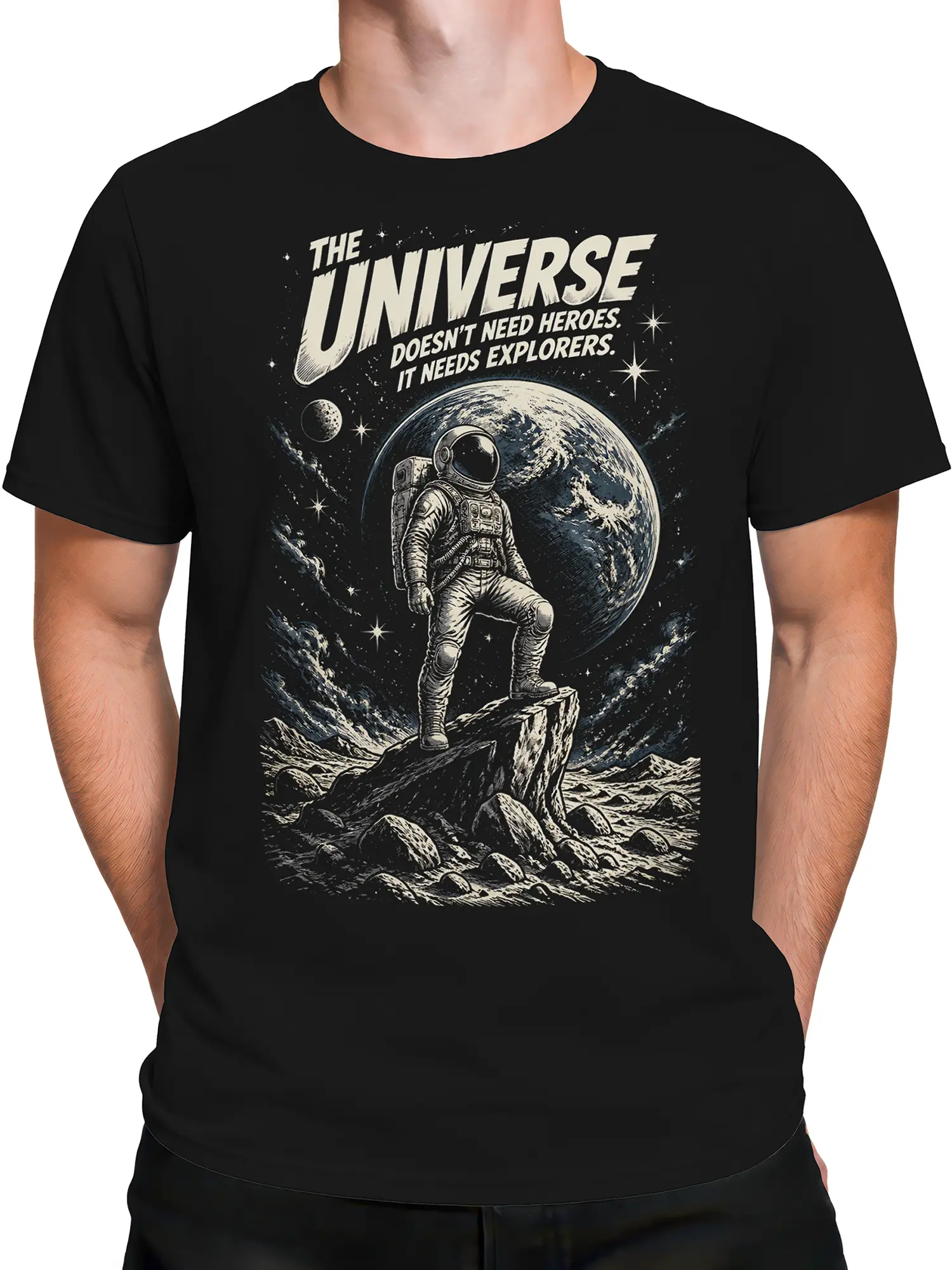 Male torso wearing a black astronaut T-shirt with a retro space scene, giant planet, and explorer message