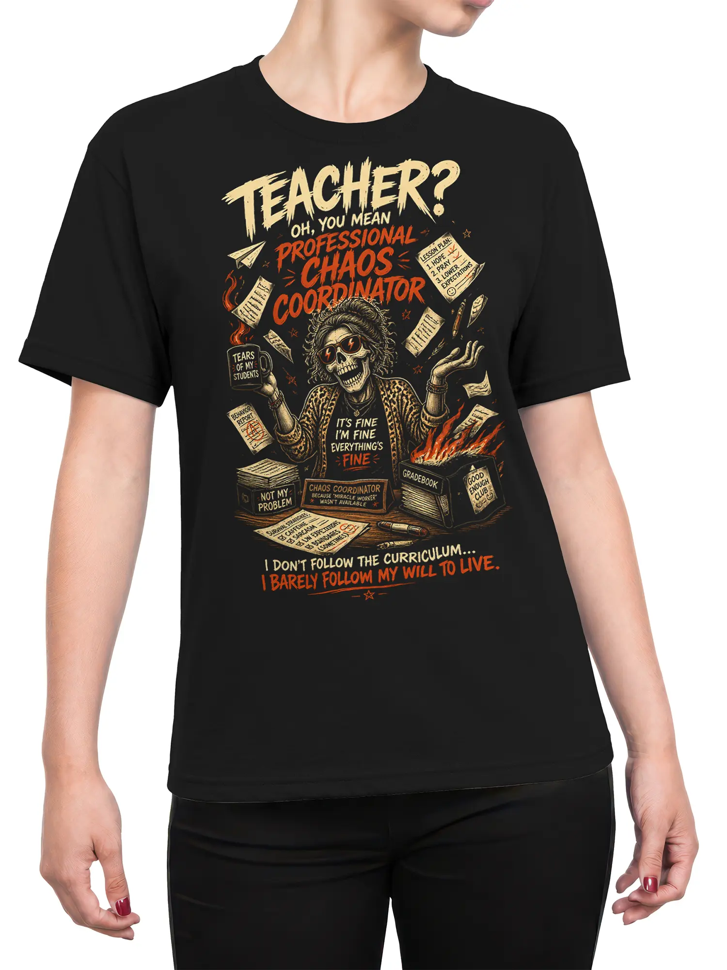 Female torso wearing a black teacher t-shirt with skull educator artwork and professional chaos classroom humor