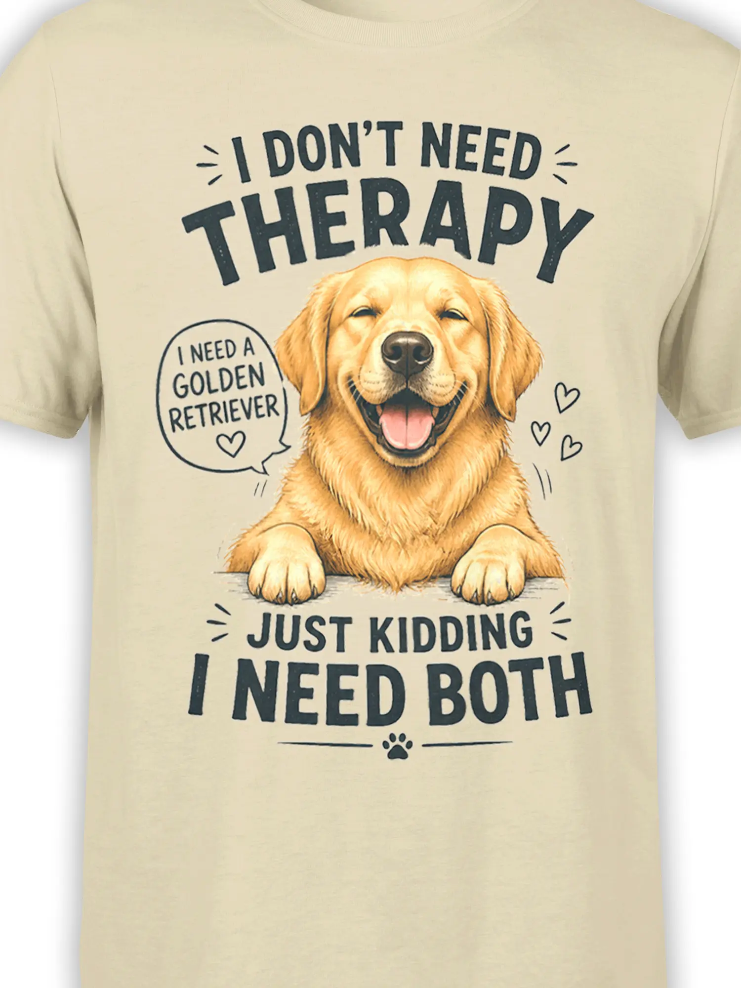 Close-up of golden retriever artwork and therapy joke printed on beige T-shirt