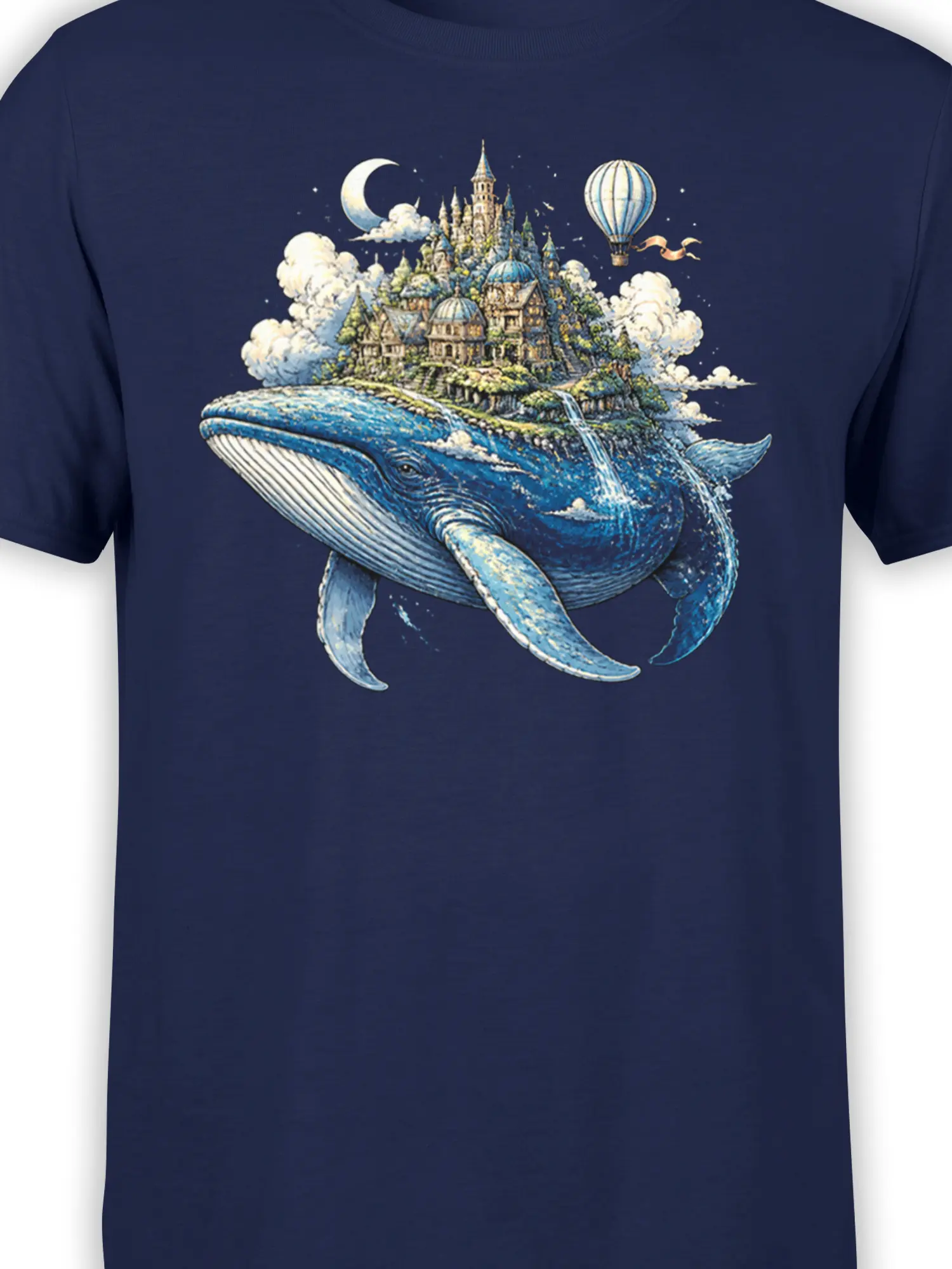 Close-up of blue whale and floating castle artwork on a navy fantasy T-shirt