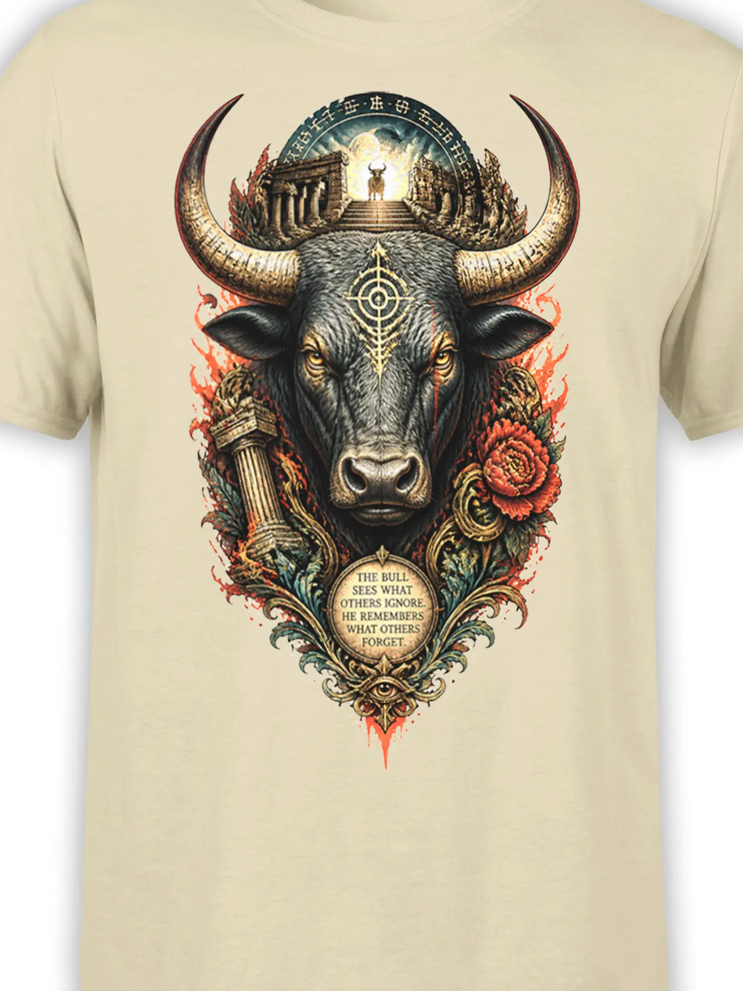 Detailed horned bull artwork with temple ruins, red flowers, eye symbol, and quote on beige T-shirt