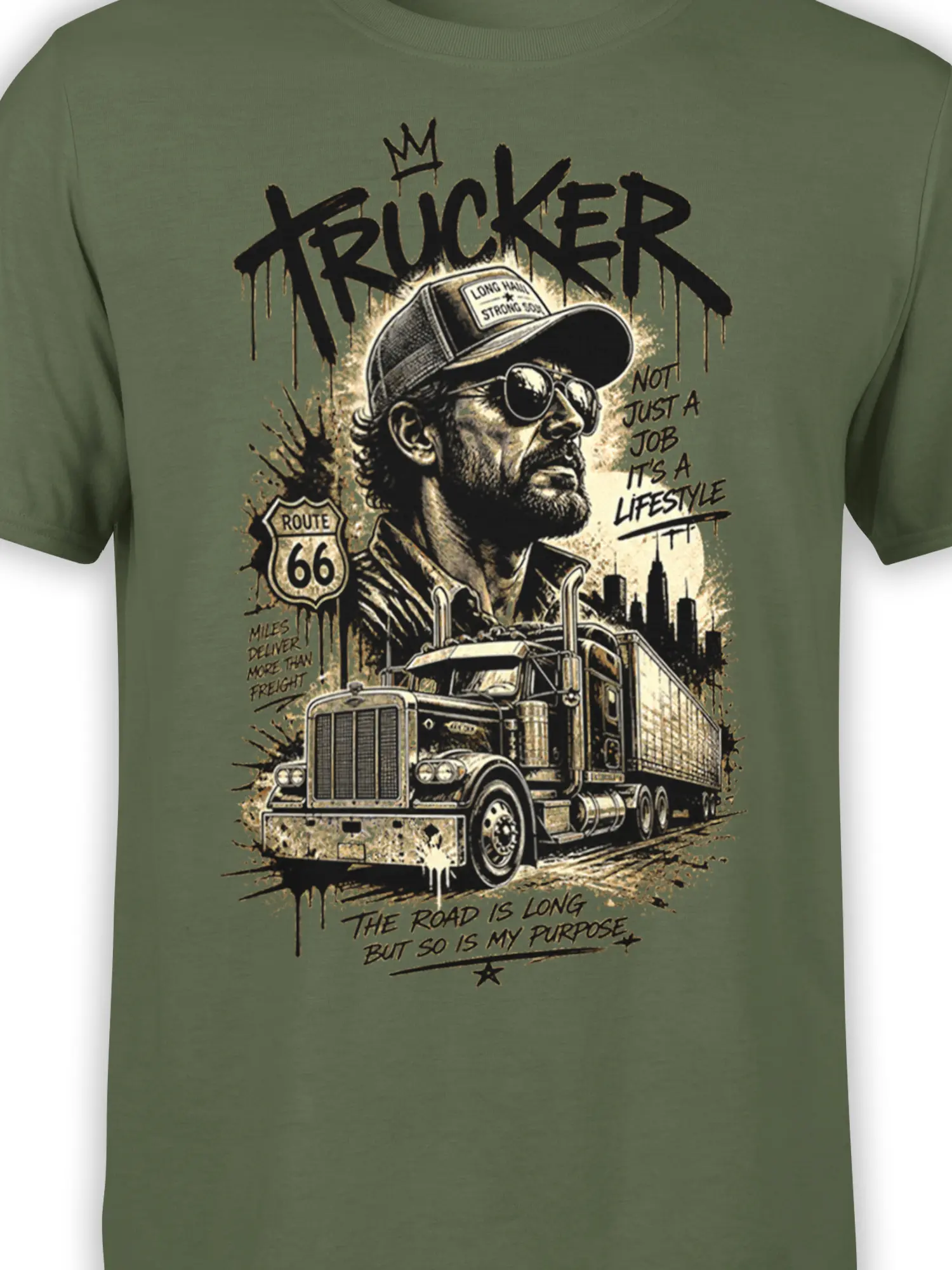Close-up of green trucker T-shirt graphic with driver, semi truck, Route 66 shield, and bold distressed lettering