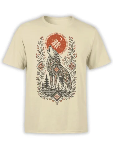 Howling wolf graphic with red moon, snowflake, forest, and folk-art details on a beige T-shirt