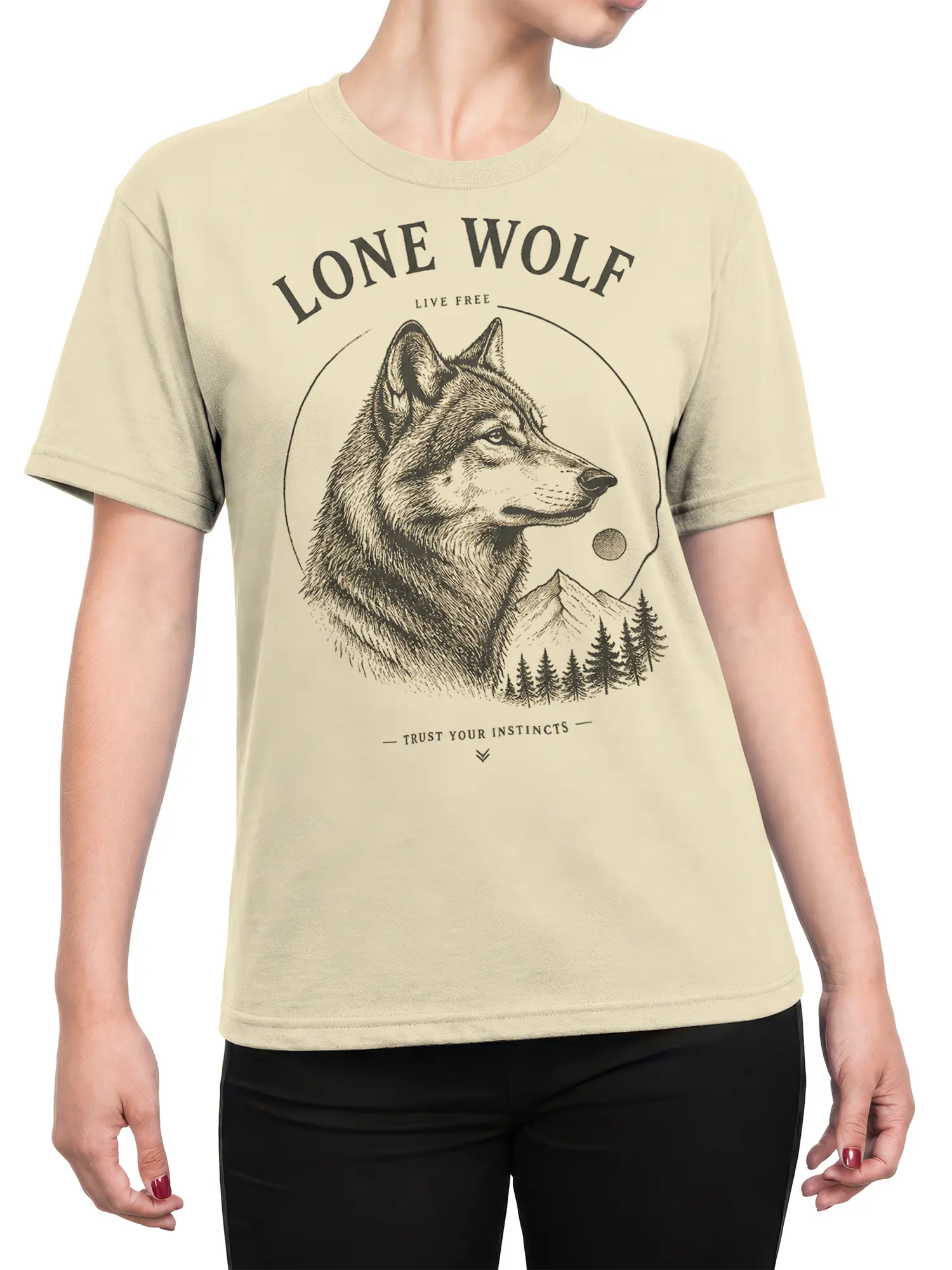 Female torso wearing a beige lone wolf T-shirt with mountain scenery and Trust Your Instincts lettering
