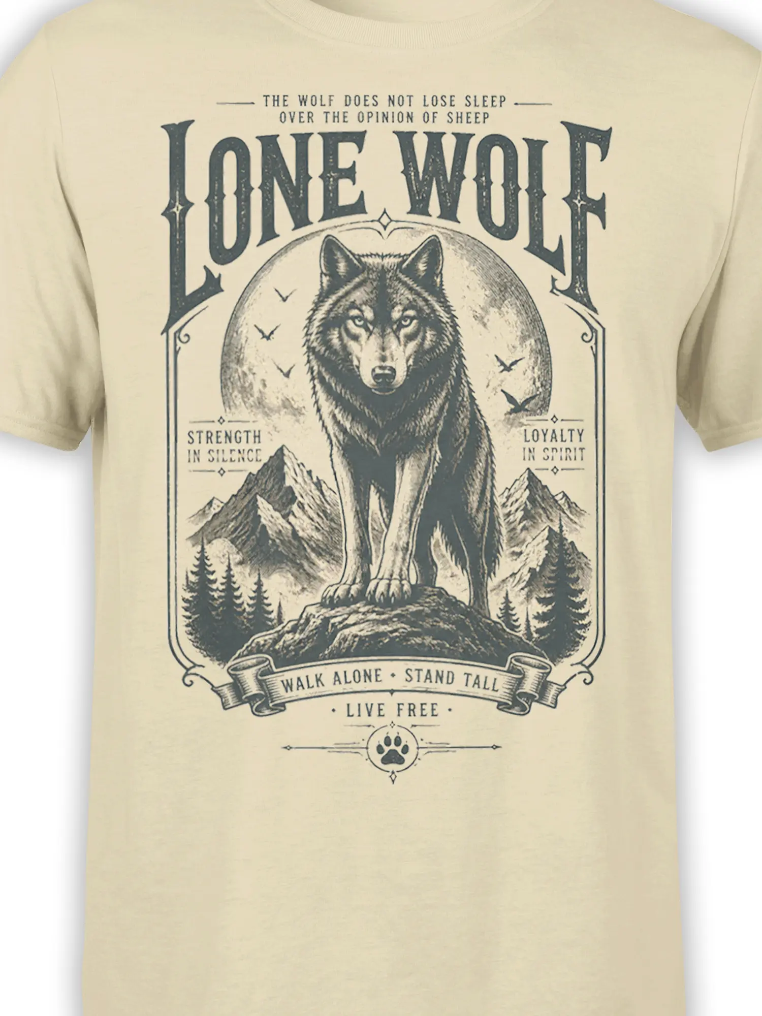 Close-up of lone wolf graphic, mountain scenery, banners, and dark vintage lettering on a beige T-shirt
