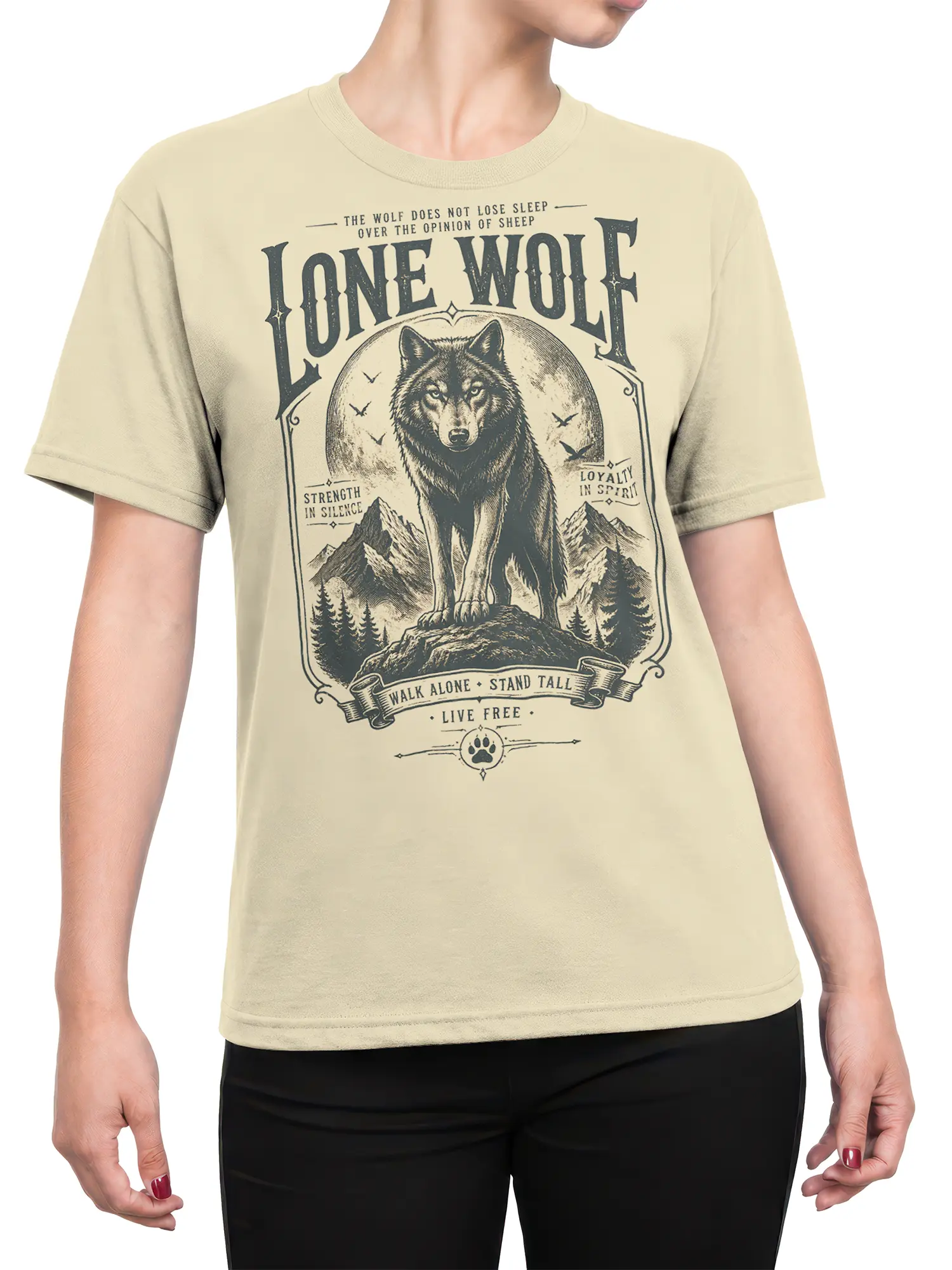 Female torso wearing a beige lone wolf T-shirt with vintage mountain artwork and bold wilderness lettering