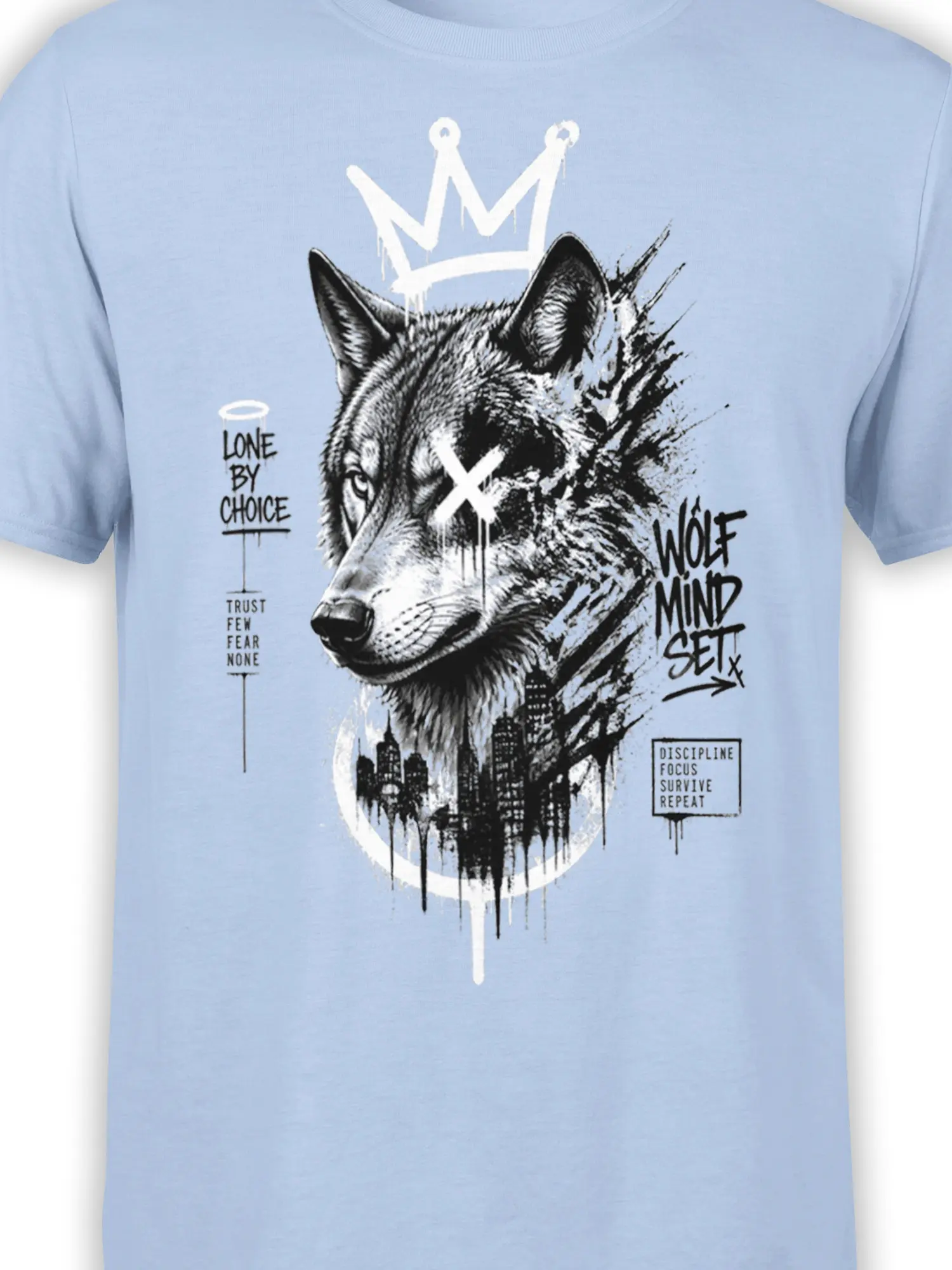 Close-up of crowned wolf artwork and mindset lettering on a light blue T-shirt