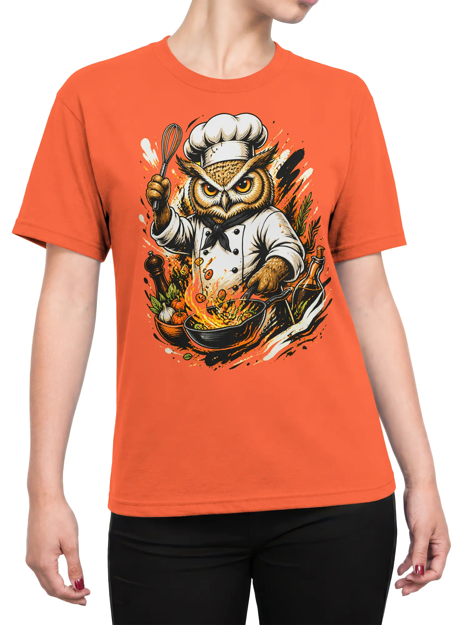 Female torso wearing an orange owl chef T-shirt with a flaming pan, whisk, vegetables, and herbs