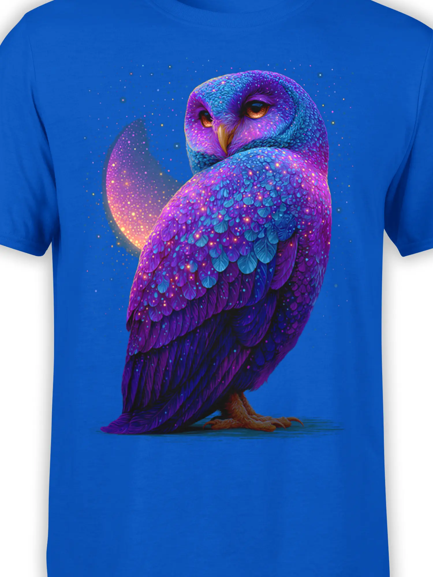 Close-up of cosmic owl feathers with glowing purple, turquoise, and galaxy details on blue fabric