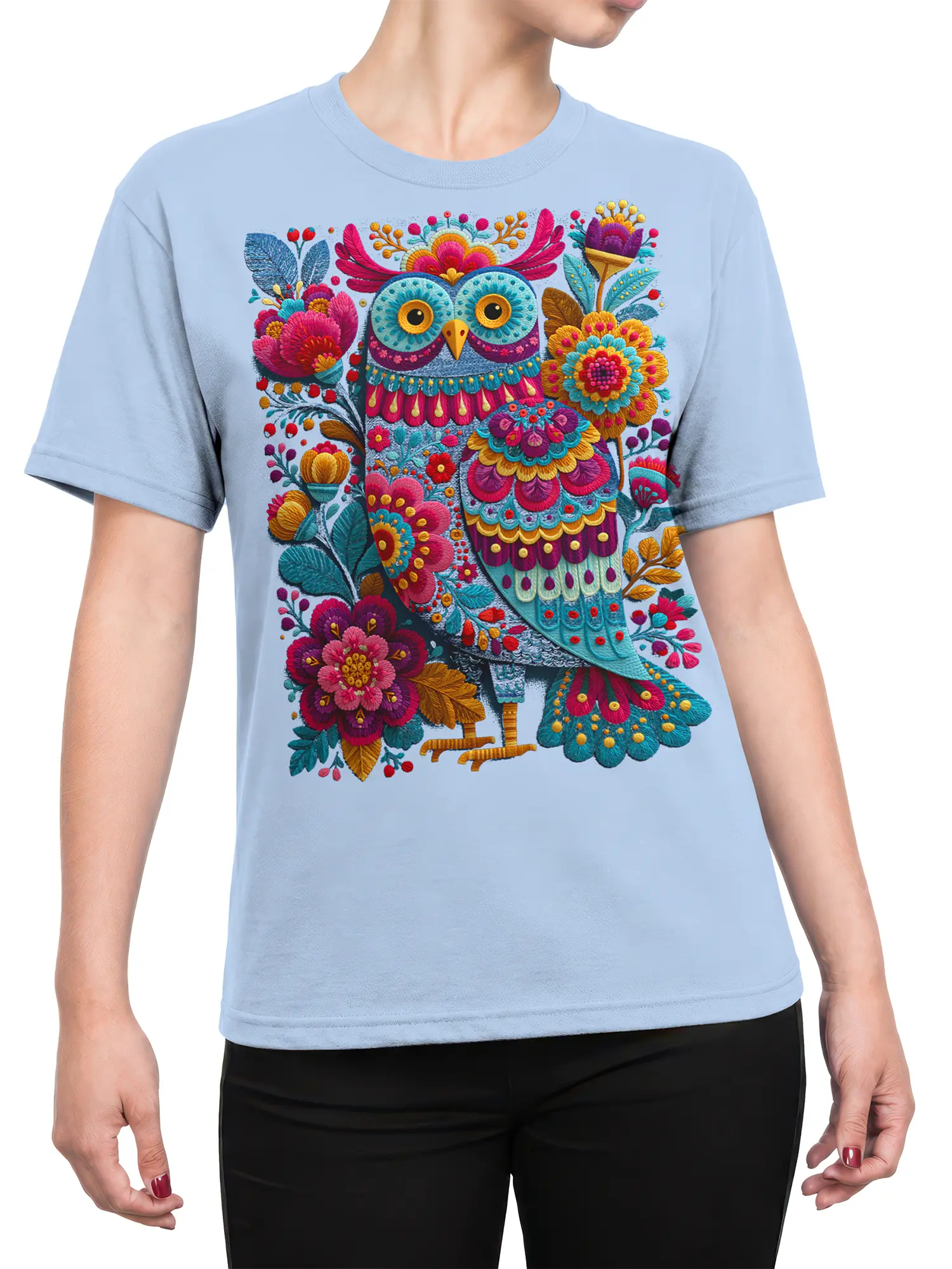 Female torso wearing a light blue T-shirt with a colorful floral owl design