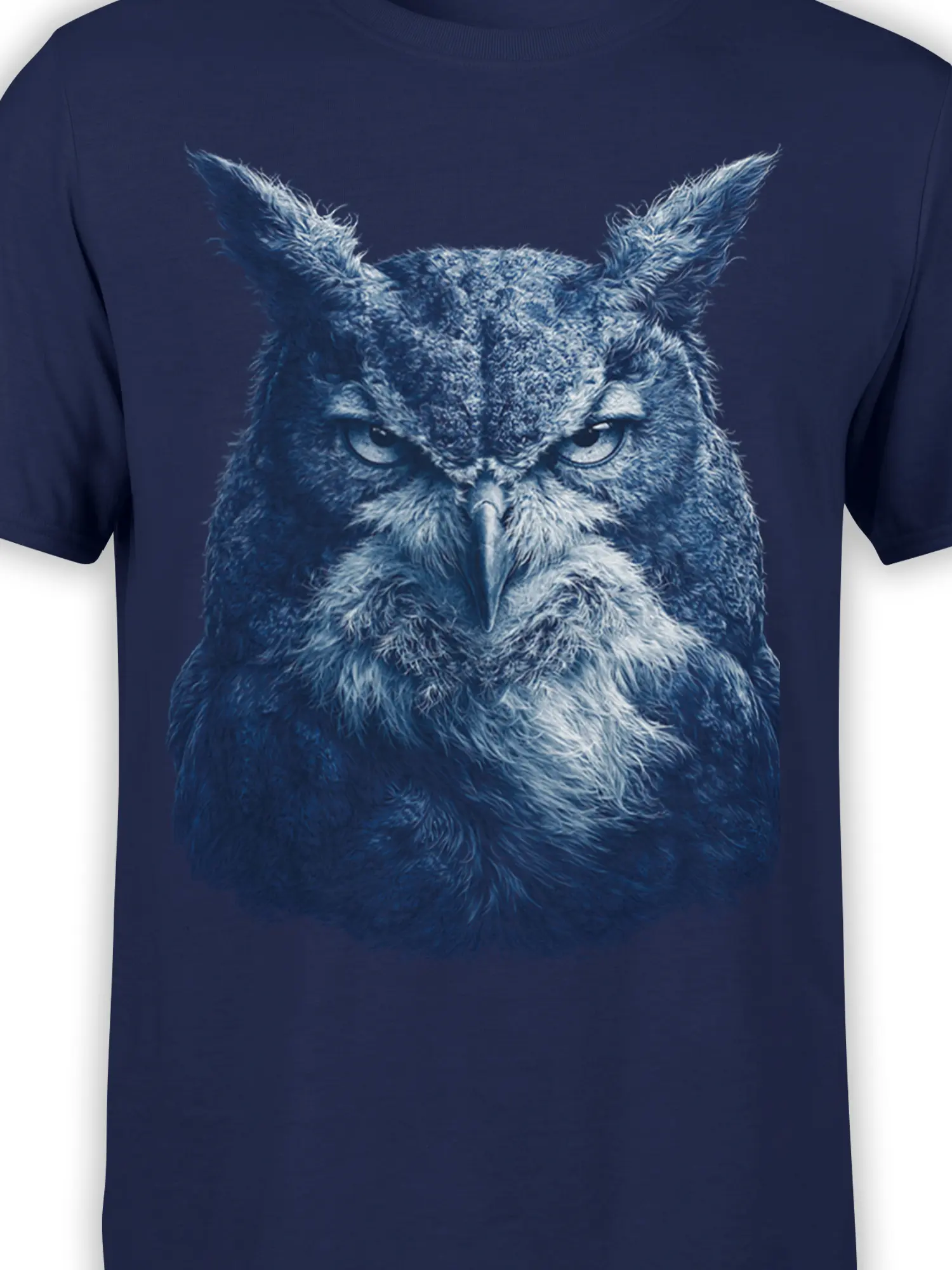Close-up of the detailed blue owl face and textured feathers on a navy T-shirt