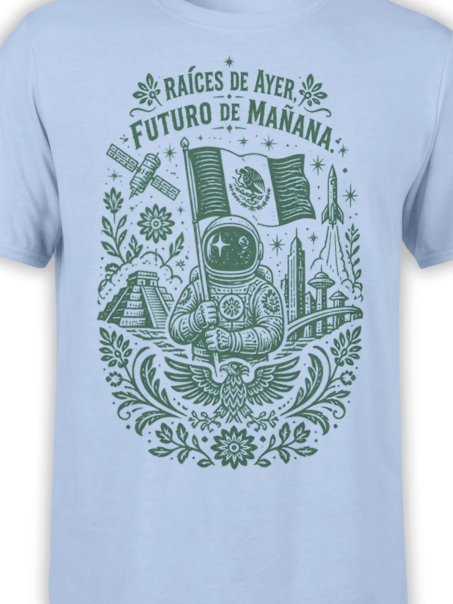 Close-up of Mexican astronaut graphic with rocket, satellite, flag, pyramid, and floral details on a light blue T-shirt