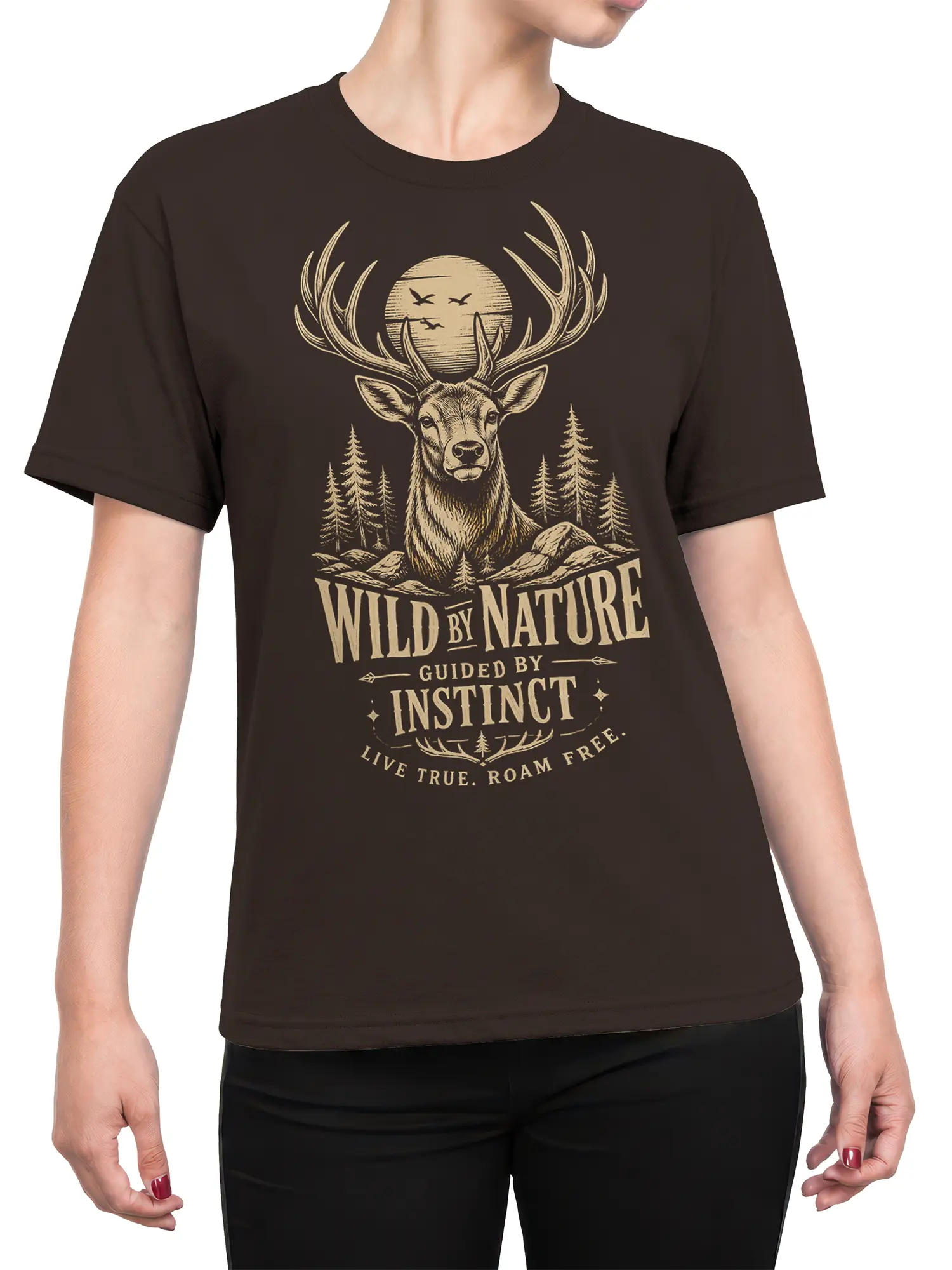 Female torso wearing a dark brown deer graphic tee with moonlit forest and “Live True” artwork