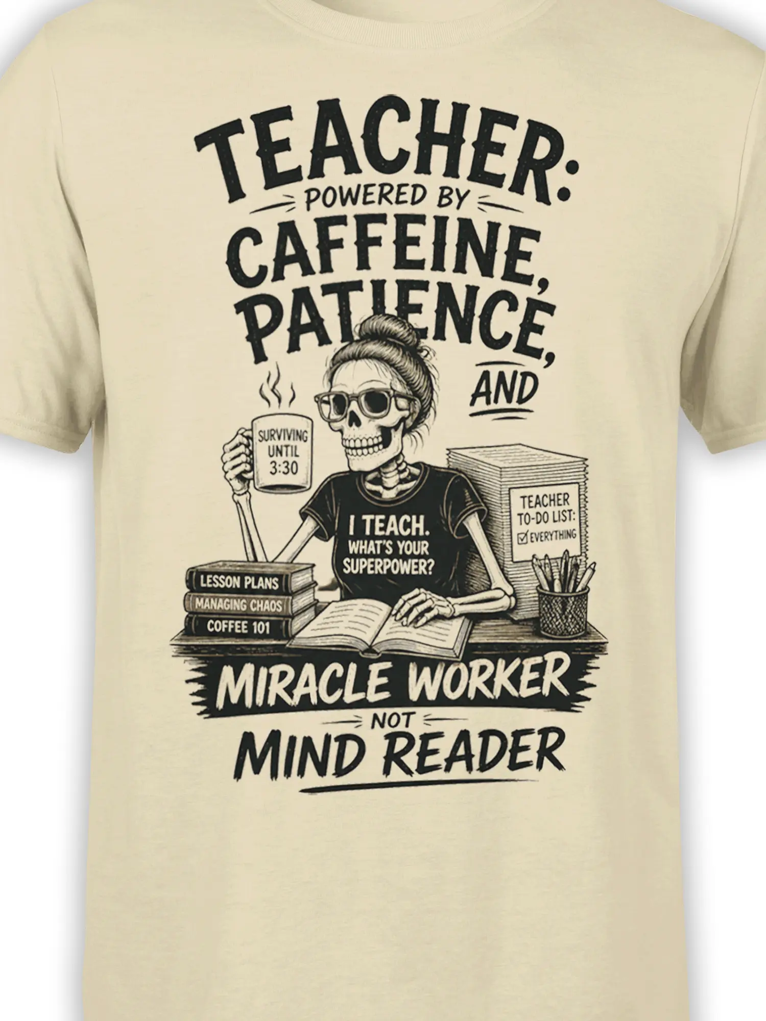 Close-up of the skeleton teacher graphic, coffee mug, lesson plans, and bold classroom lettering on beige fabric