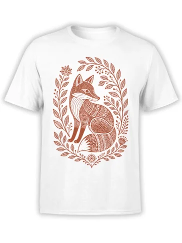 White T-shirt with a rust-brown folk art fox surrounded by leafy branches, flowers, berries, and botanical details