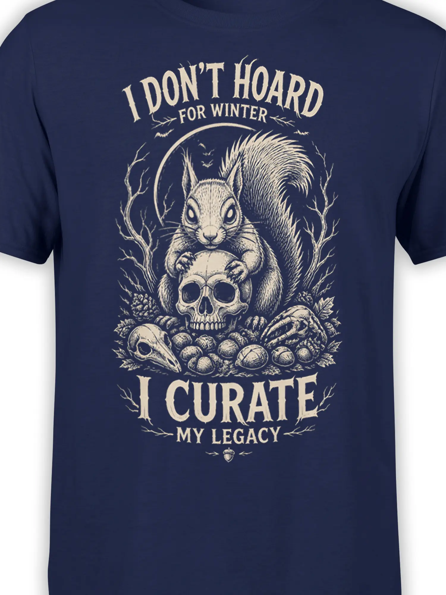 Close-up of the squirrel, skull, acorns, and vintage woodland artwork on a navy T-shirt