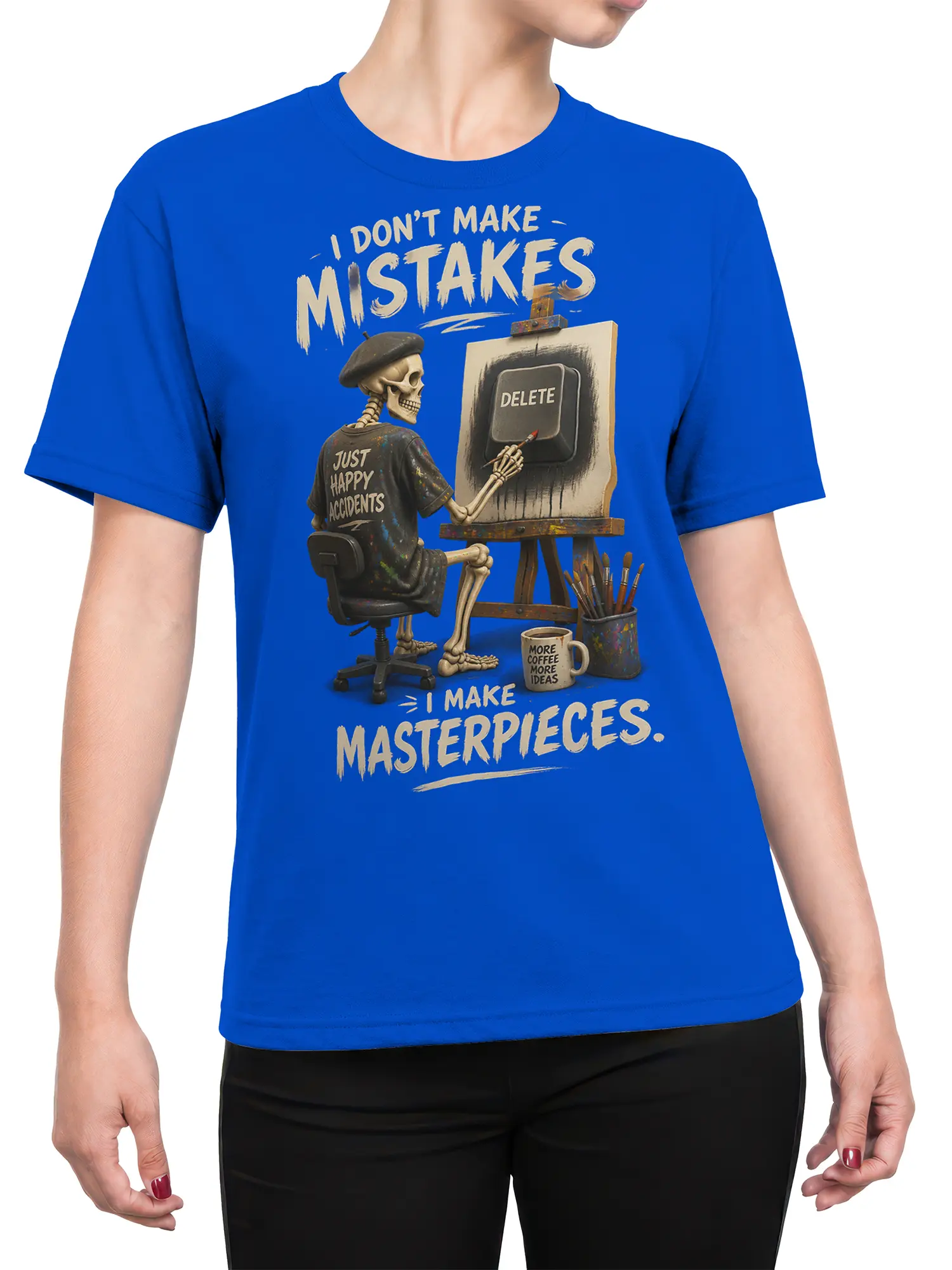 Female torso wearing a blue artist T-shirt with skeleton painter artwork and happy accidents lettering