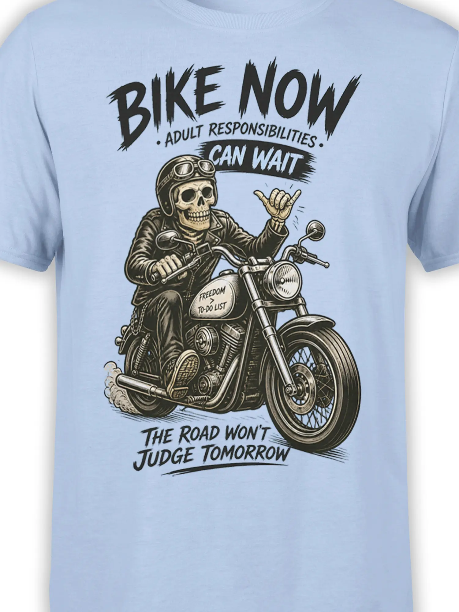 Close-up of skeleton biker motorcycle artwork and freedom message on a light blue T-shirt