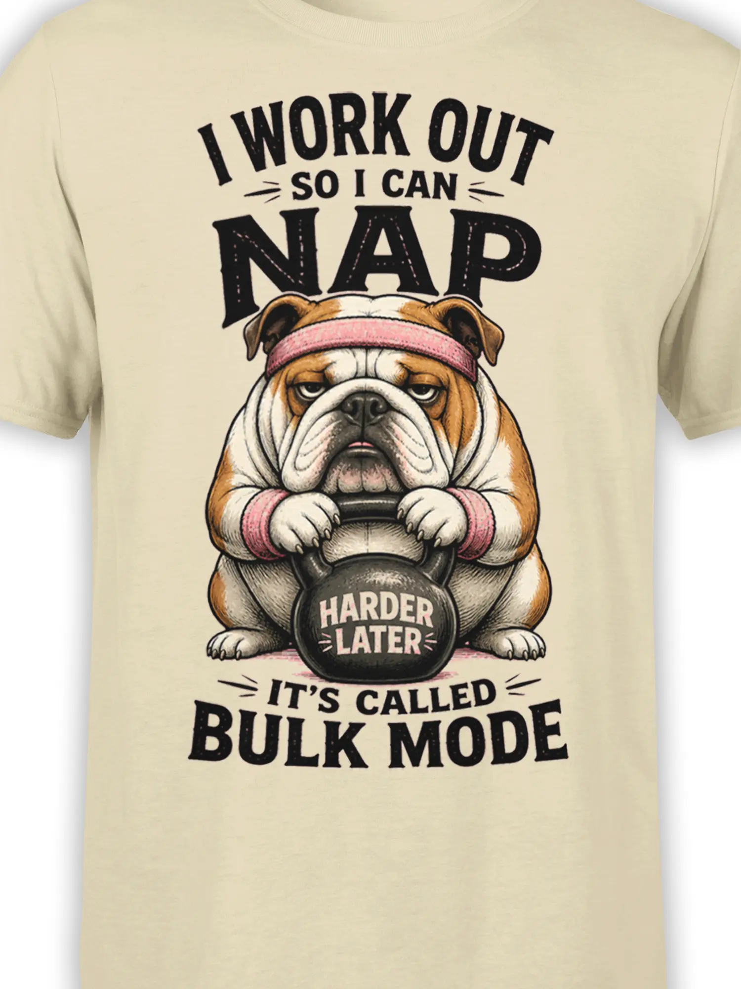 Close-up of the bulldog kettlebell design and bold workout lettering on a beige T-shirt