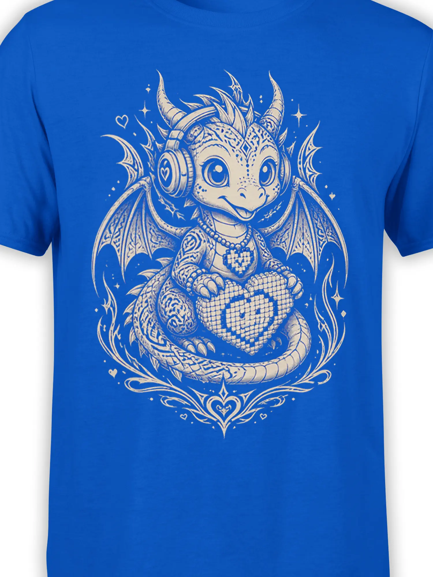 Close-up of the cream headphone dragon artwork with horns, wings, heart details, and stars on blue fabric
