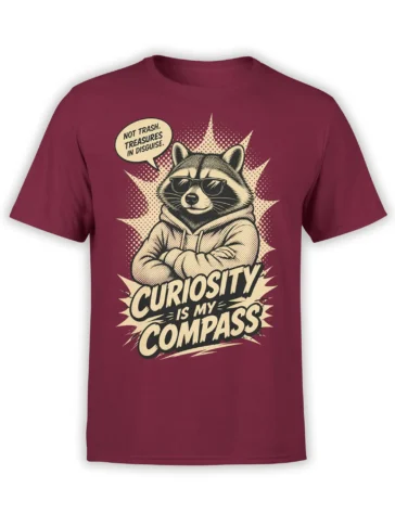 Curious raccoon in sunglasses and hoodie on a burgundy T-shirt with “Curiosity Is My Compass” text