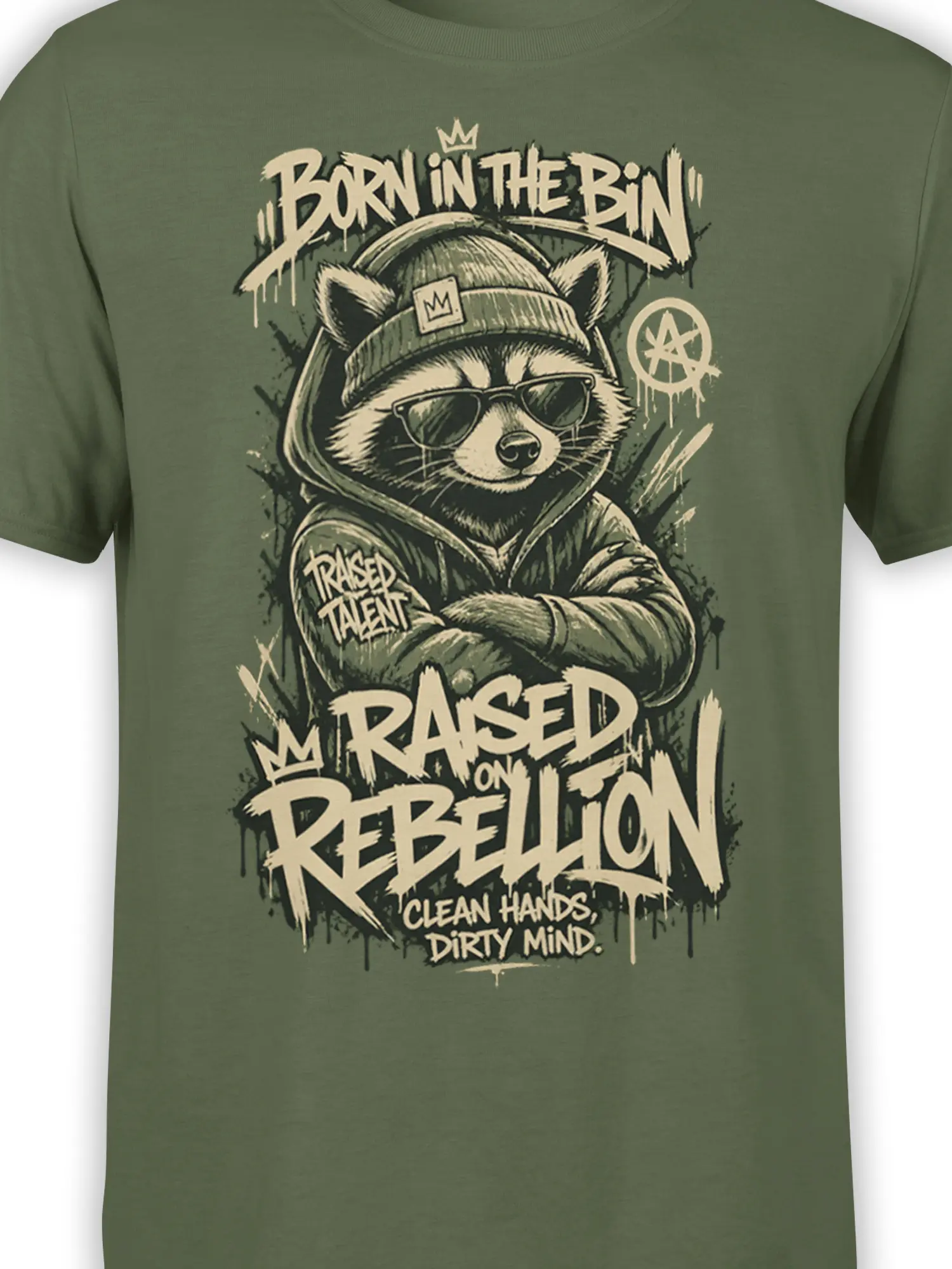 Close-up of green raccoon graphic with crown, sunglasses, beanie, hoodie, and distressed streetwear text