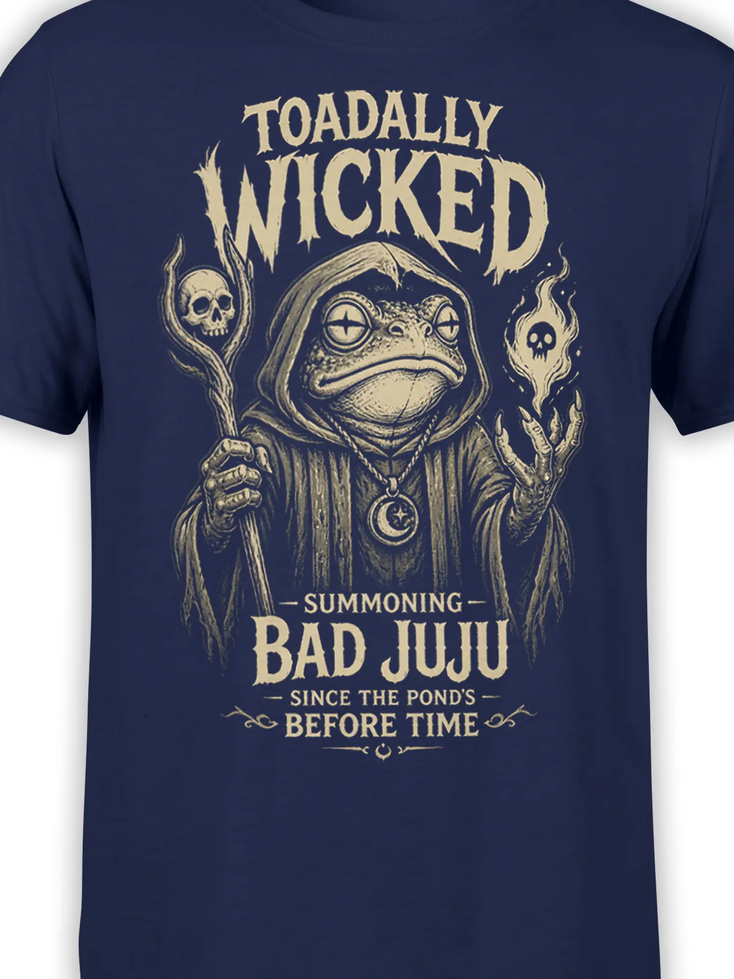 Close-up of hooded toad artwork, skull flames, and bad juju lettering on a navy T-shirt