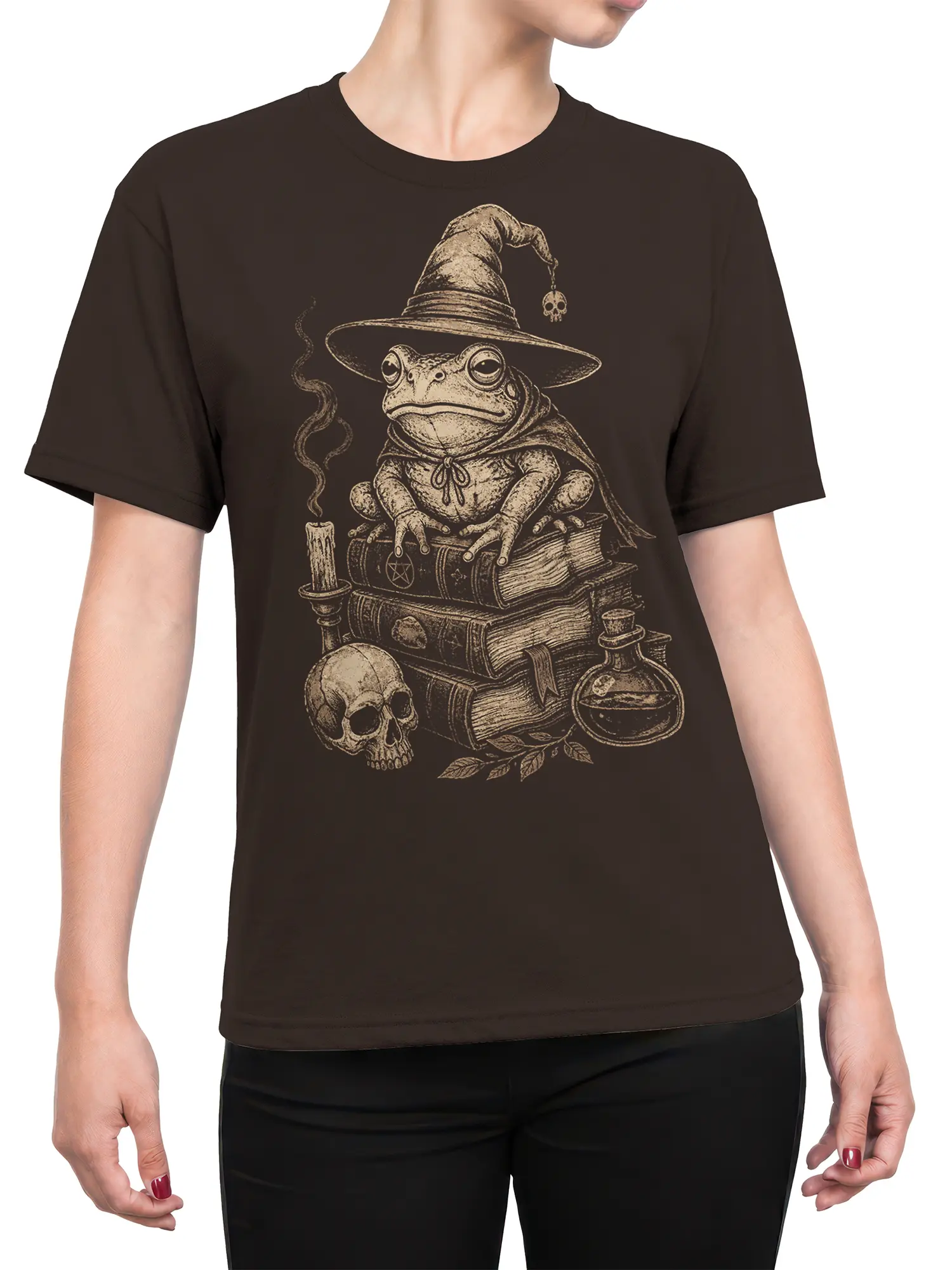 Female torso wearing a brown shirt with a vintage frog wizard, books, skull, candle, and potion design