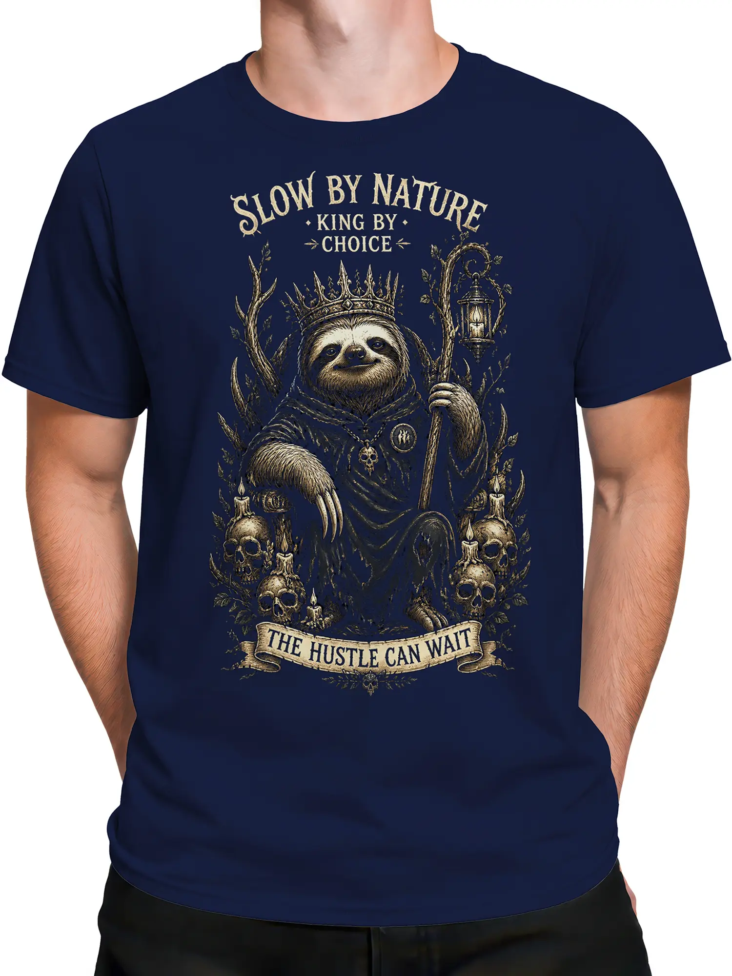 Male torso wearing a navy crowned sloth graphic tee with gothic forest artwork and vintage lettering