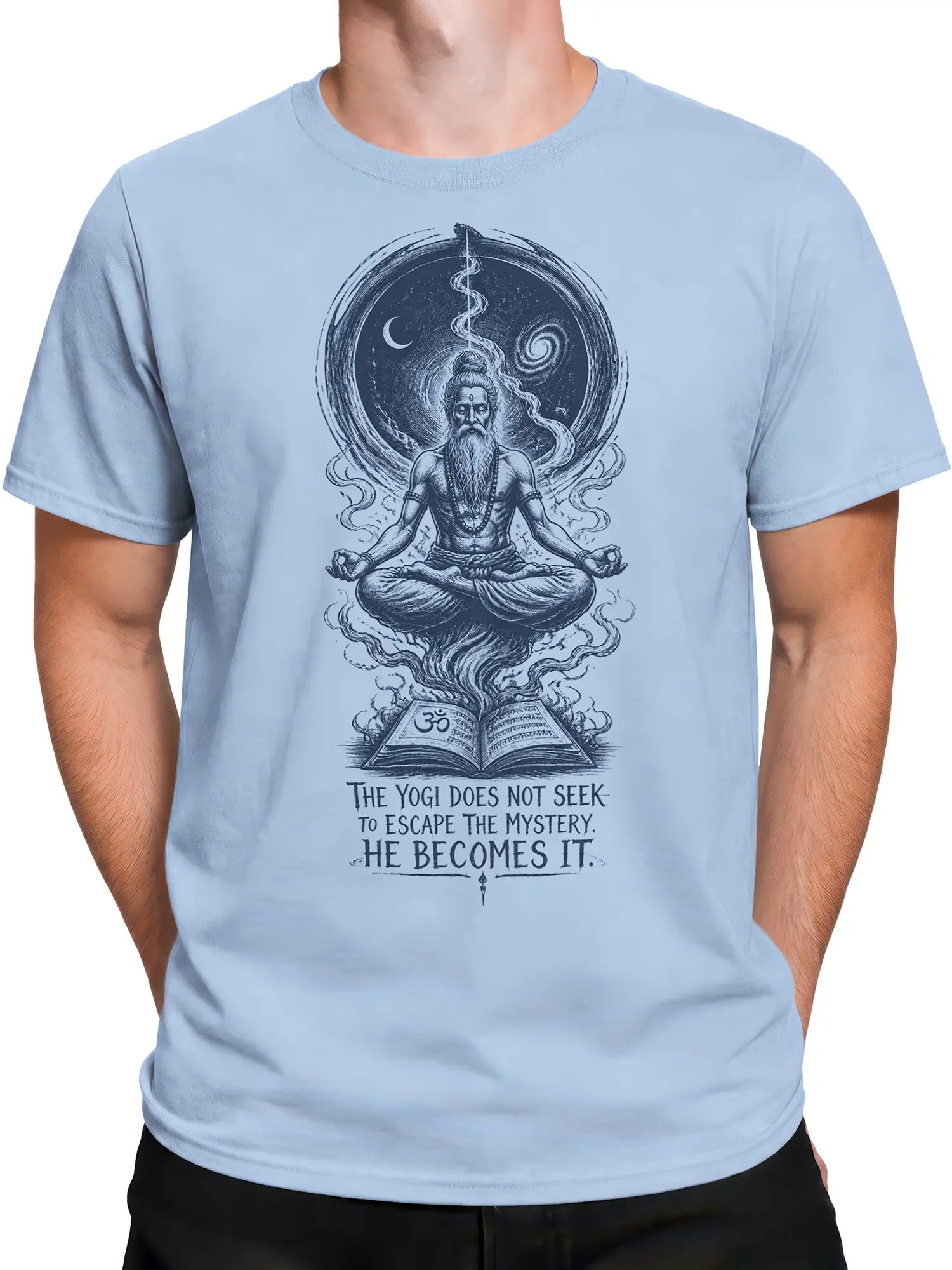 Male torso wearing a light blue yoga T-shirt with meditating yogi and mystical book artwork