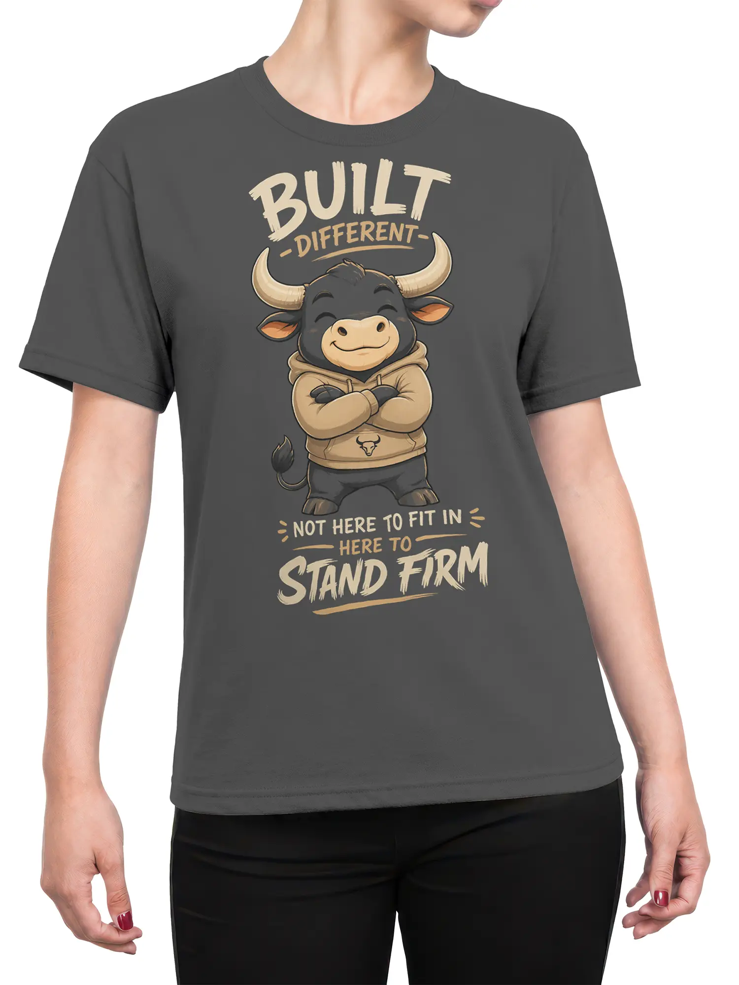 Female torso wearing a gray bull T-shirt with Built Different and Stand Firm artwork