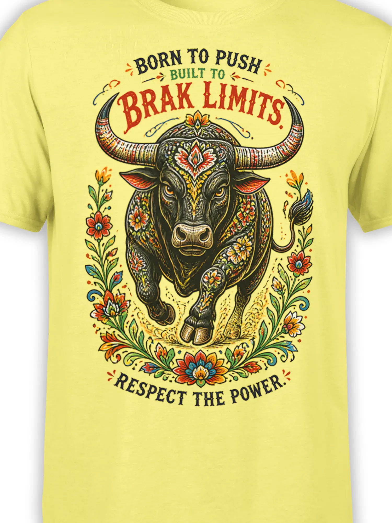 Close-up of floral bull artwork with large horns and “Break Limits” text on a yellow shirt